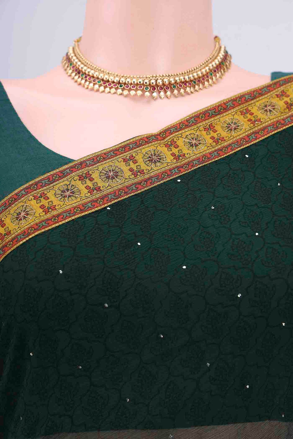 Border image of Bottle Green Chiffon Saree with Printed design on the body and Attached Border