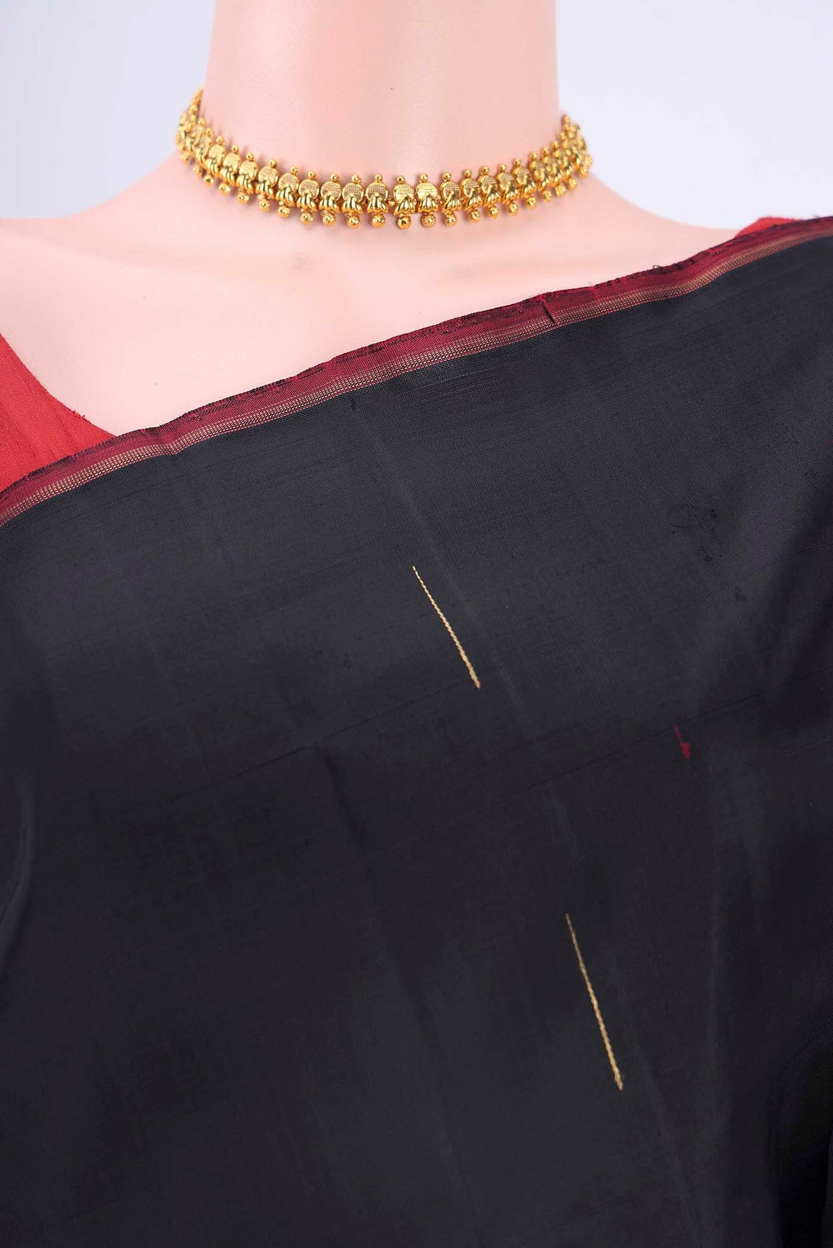 Border image of Black Kanchipuram Silk Saree with Zari Butta on the body and Zari Border