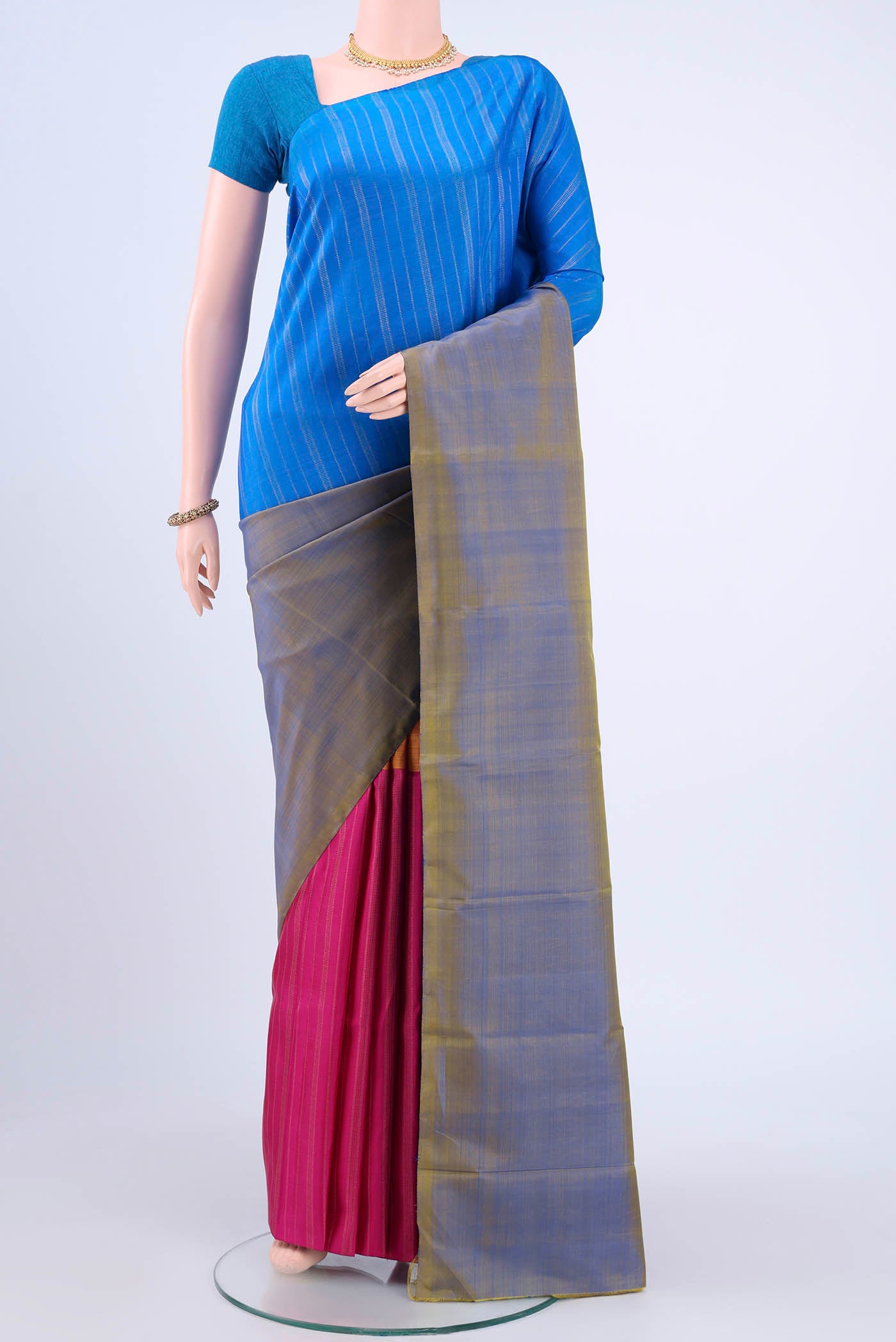 Blue Kanchipuram Saree with Zari Butta on the body and Zari Border displayed on a mannequin