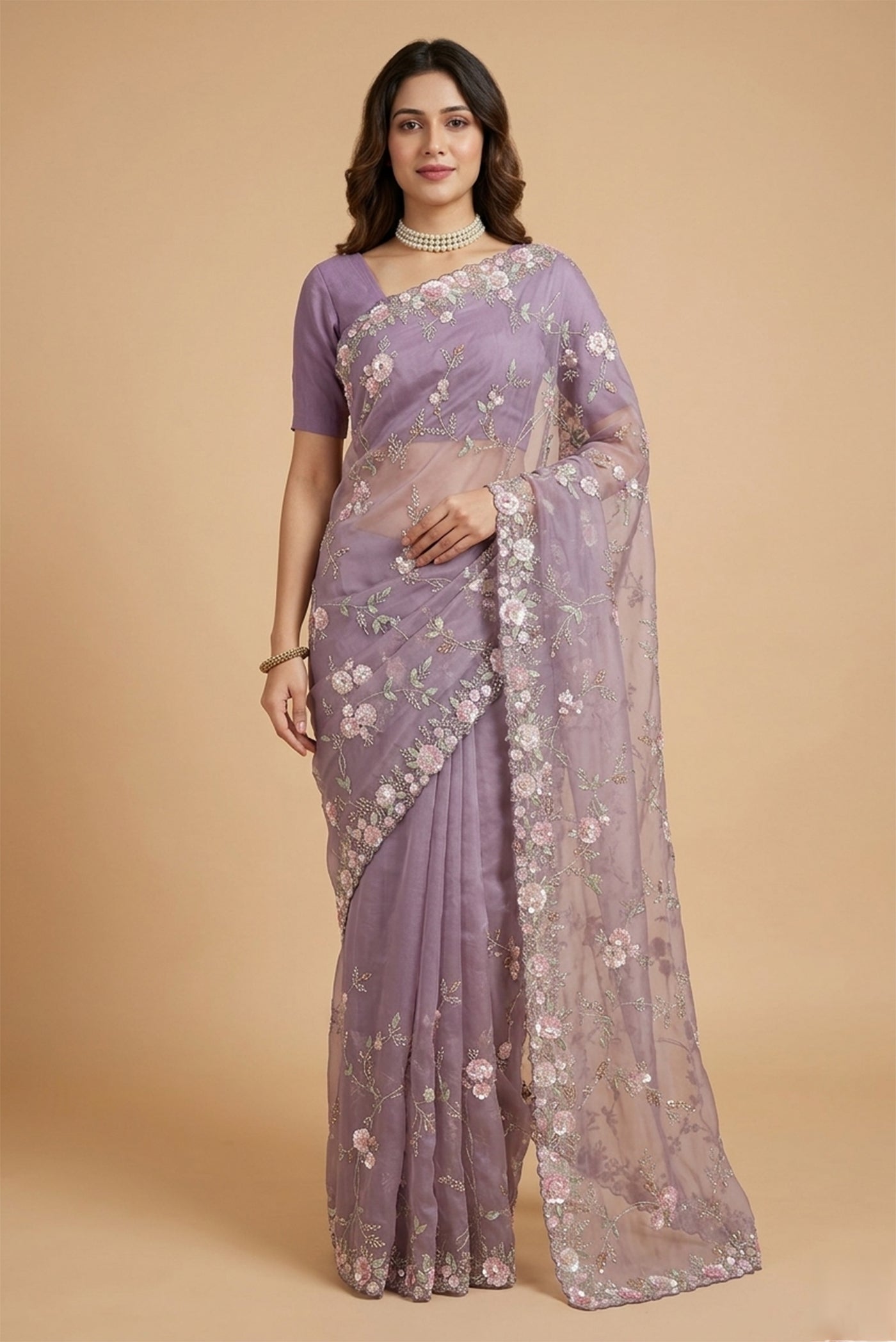 Model wearing a Lavender Organza Silk Saree with Embroidery on the body and Embroidery Border.