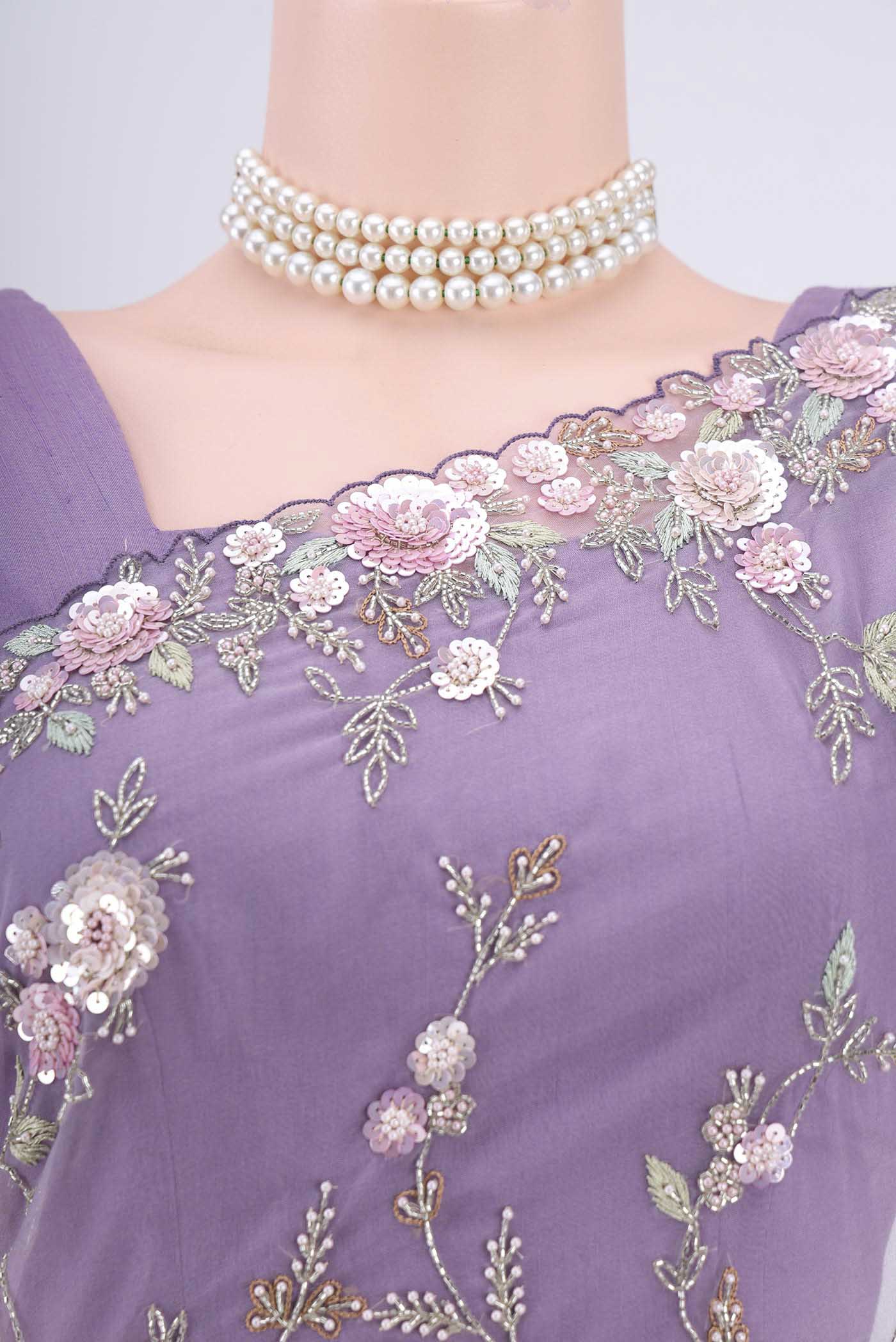 Border image of Violet Organza Silk Saree with Embroidery on the body and Embroidery Border. 