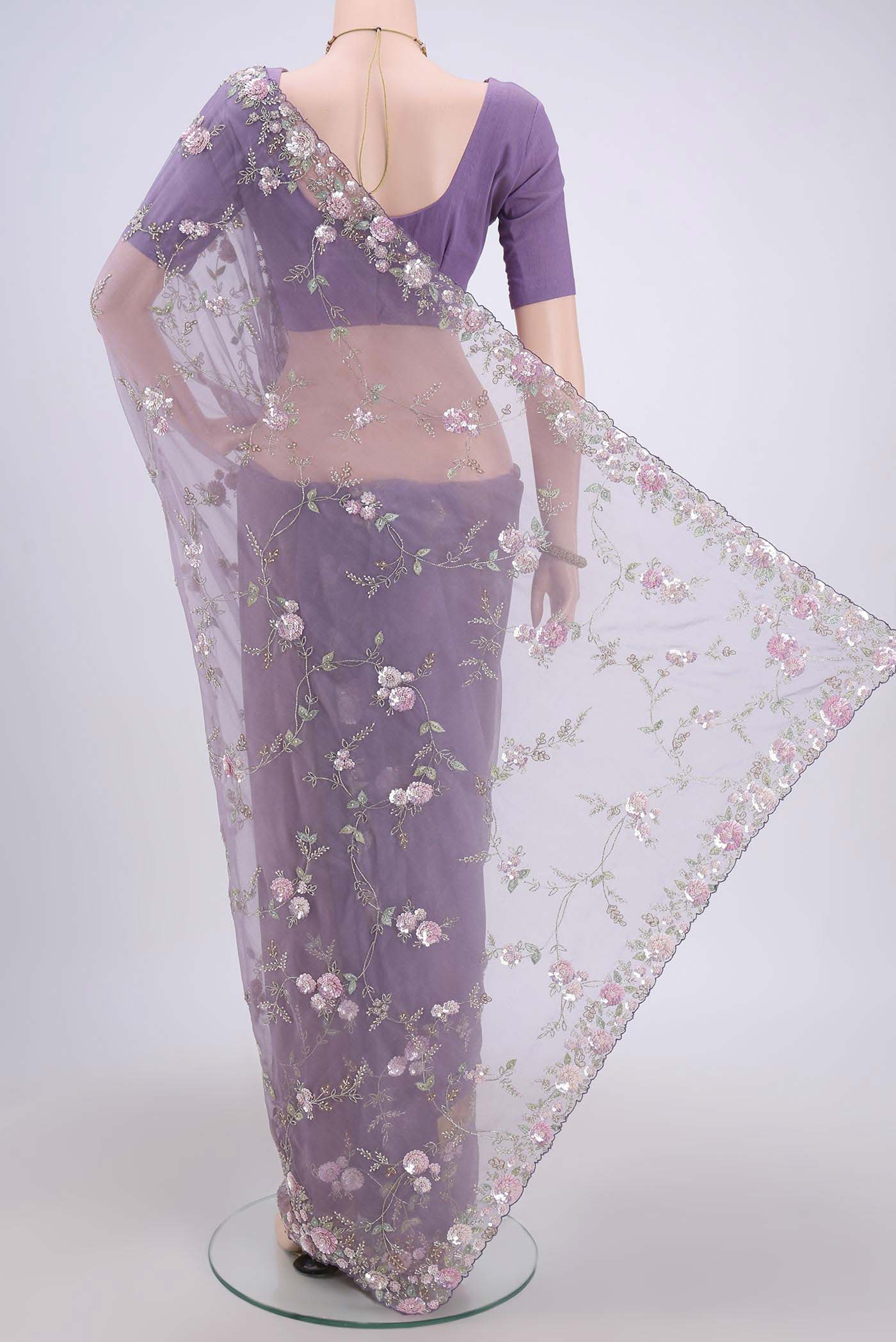Flat view of Violet Organza Silk Saree with Embroidery on the body and Embroidery Border. 