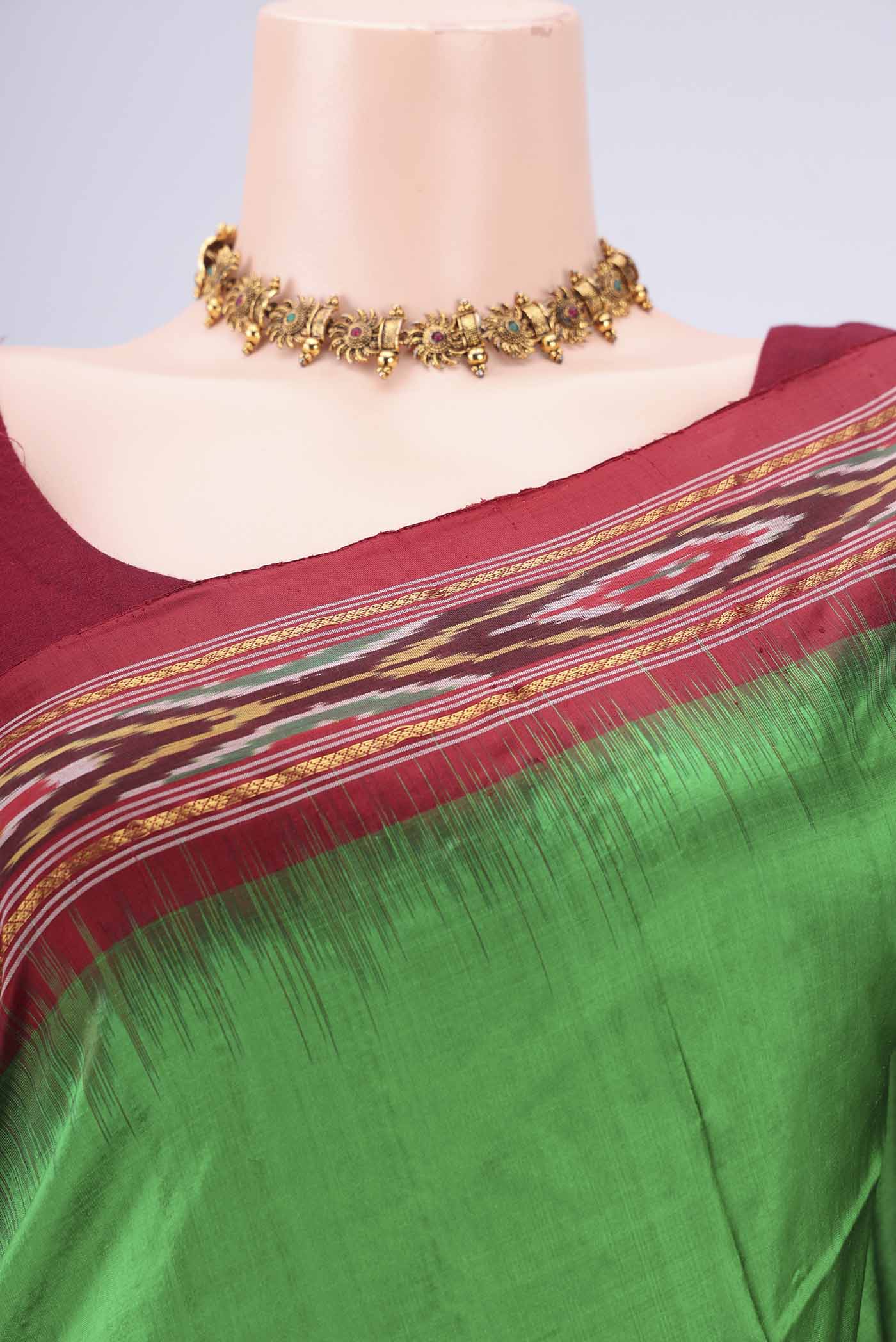 Border image of Green Pochampally Silk Saree with Plain Body and Ikat Border. 