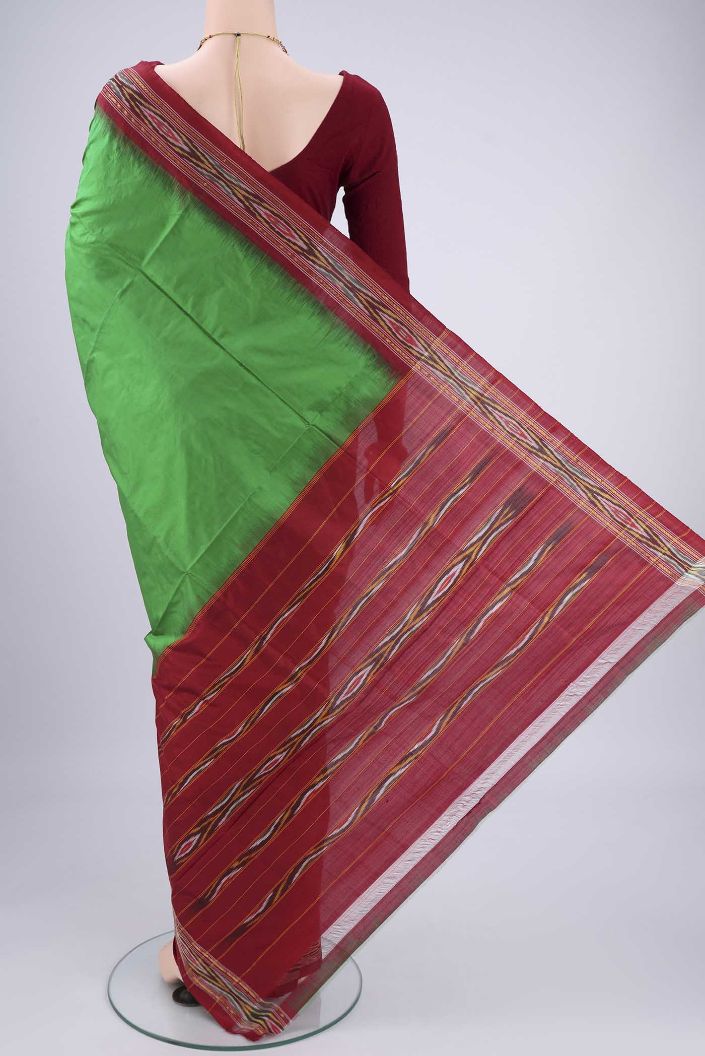 Flat view of Green Pochampally Silk Saree with Plain Body and Ikat Border. 