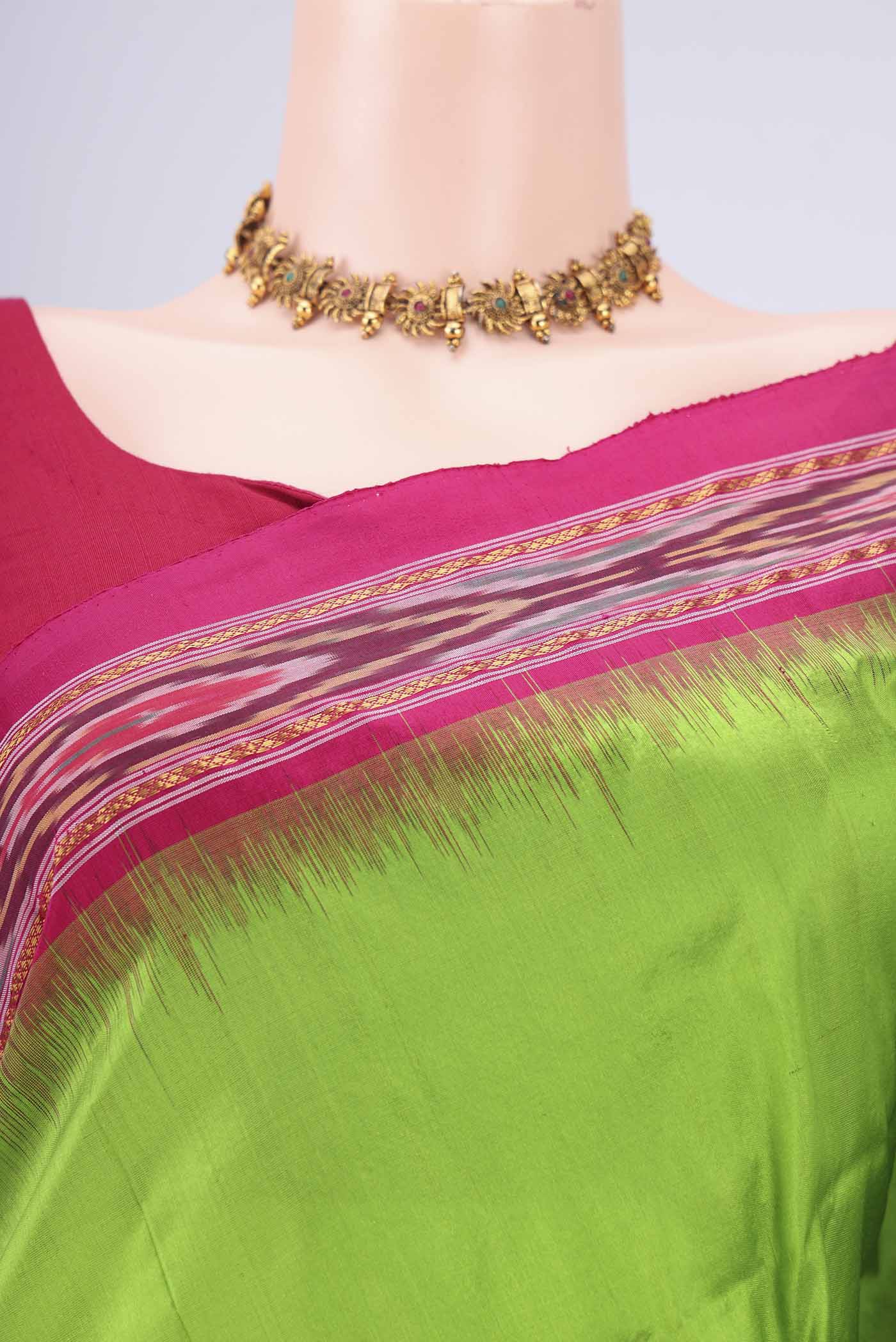 Border image of Parrot Green Pochampally Silk Saree with Plain Body and Ikat Border. 