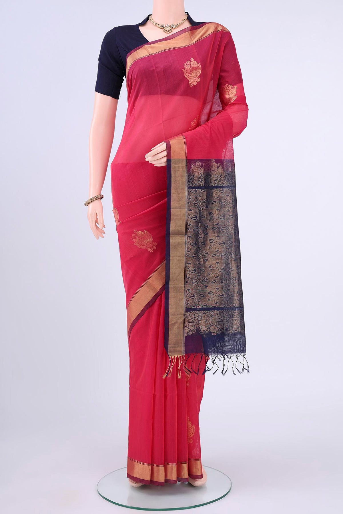 Imperial Pink Kora Cotton Saree with Zari Butta on the body and Thin Zari Line displayed on a mannequin