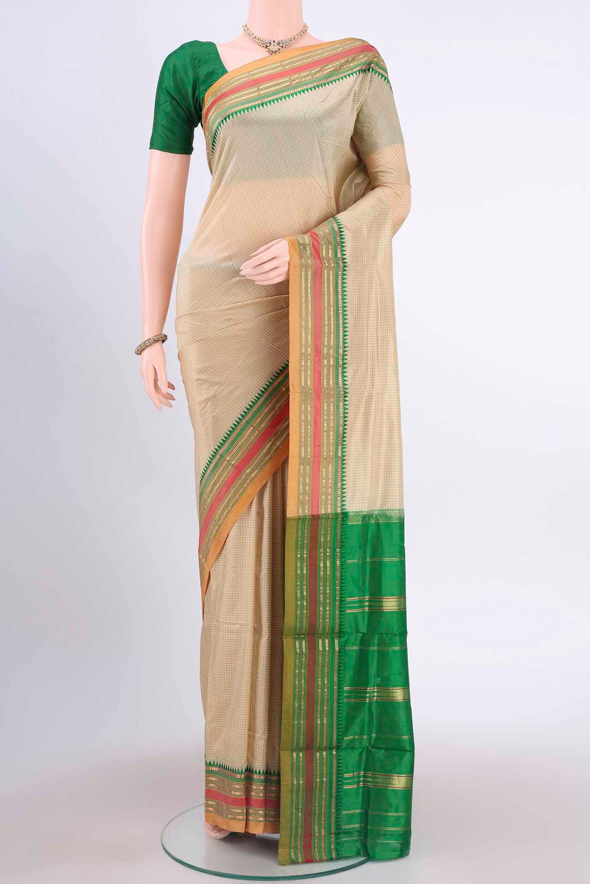 Beige Narayanpet Silk Saree with Checked design on the body and Zari Border displayed on a mannequin