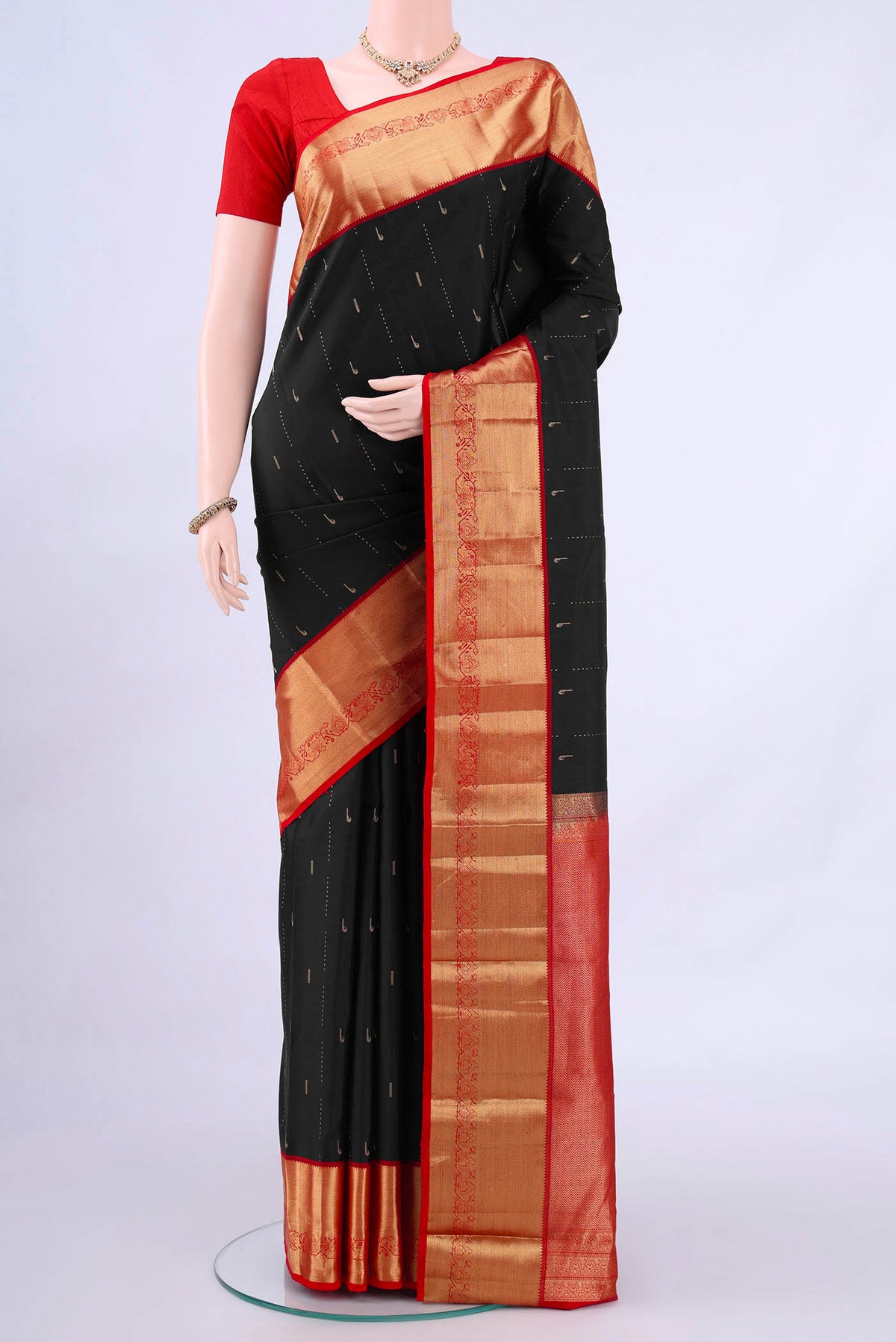 Black Nangavalli Silk [ Salem ] Saree with Zari Butta on the body and Zari Border displayed on a mannequin