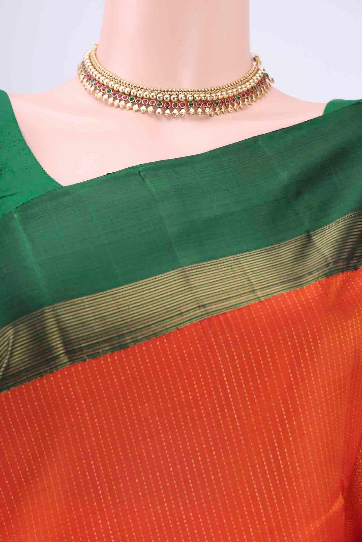 Border image of Brick Orange Dual Tone Kanchipuram Saree with Stripes on the body and Zari Border
