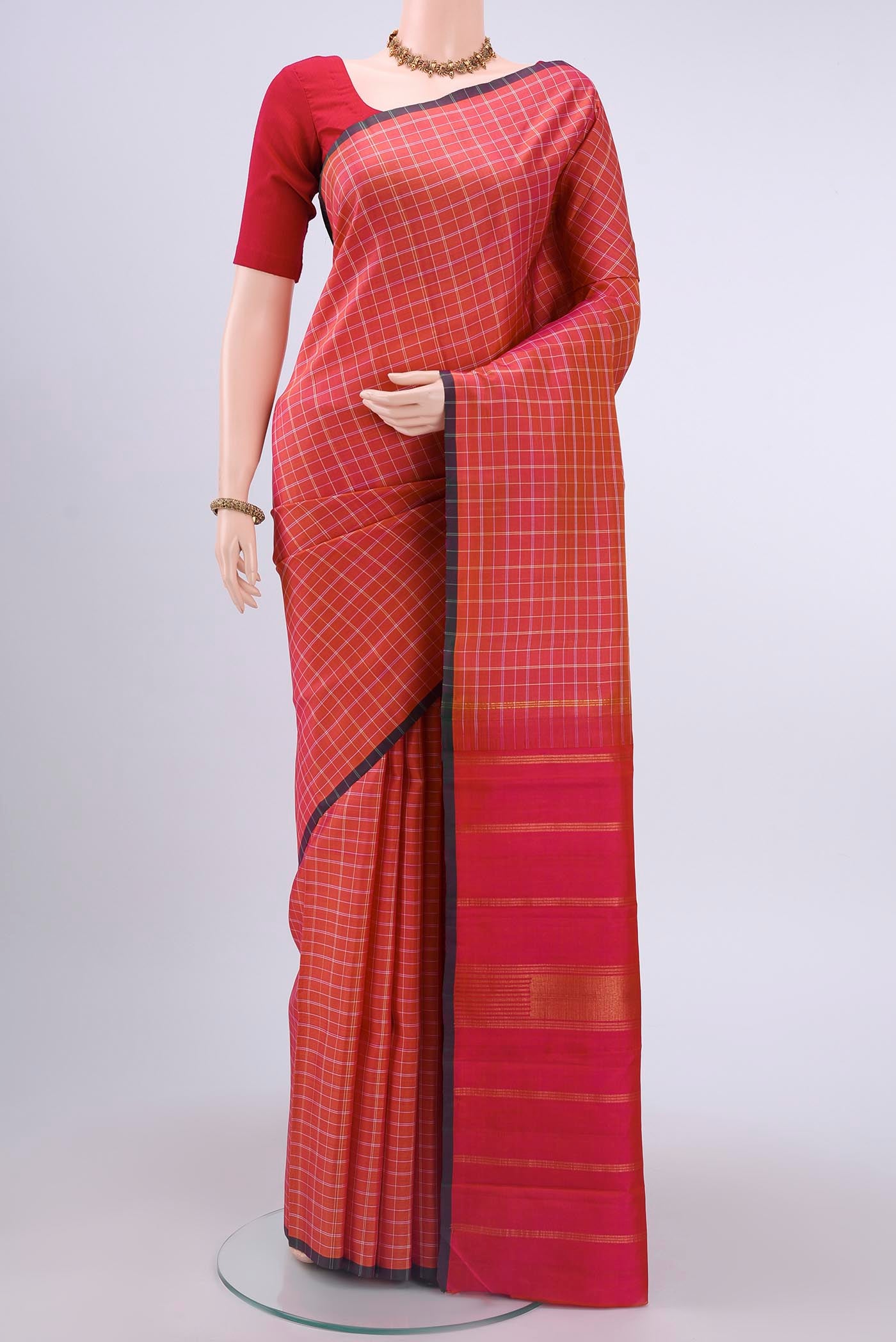 Pink with Orange Color Kanchipuram Silk Saree with Checked design on the body and Without Border displayed on a mannequin