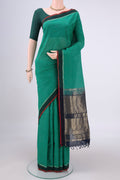 Bottle Green Kanchi Cotton Saree with Thread Butta on the body and Zari Border.  displayed on a mannequin