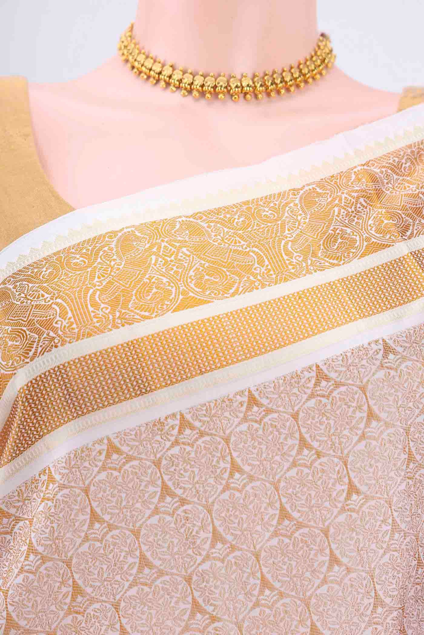 Border image of White Dual Tone Kanchipuram Silk Saree with Jacquard design on the body and Thin Zari Line