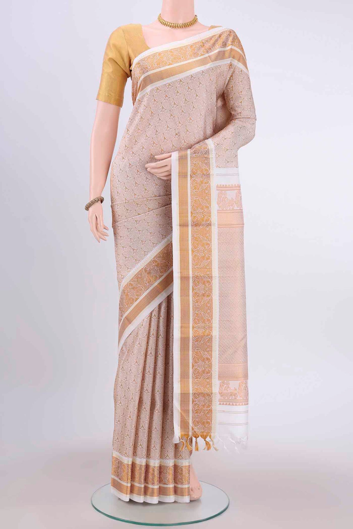 White Dual Tone Kanchipuram Silk Saree with Jacquard design on the body and Thin Zari Line displayed on a mannequin