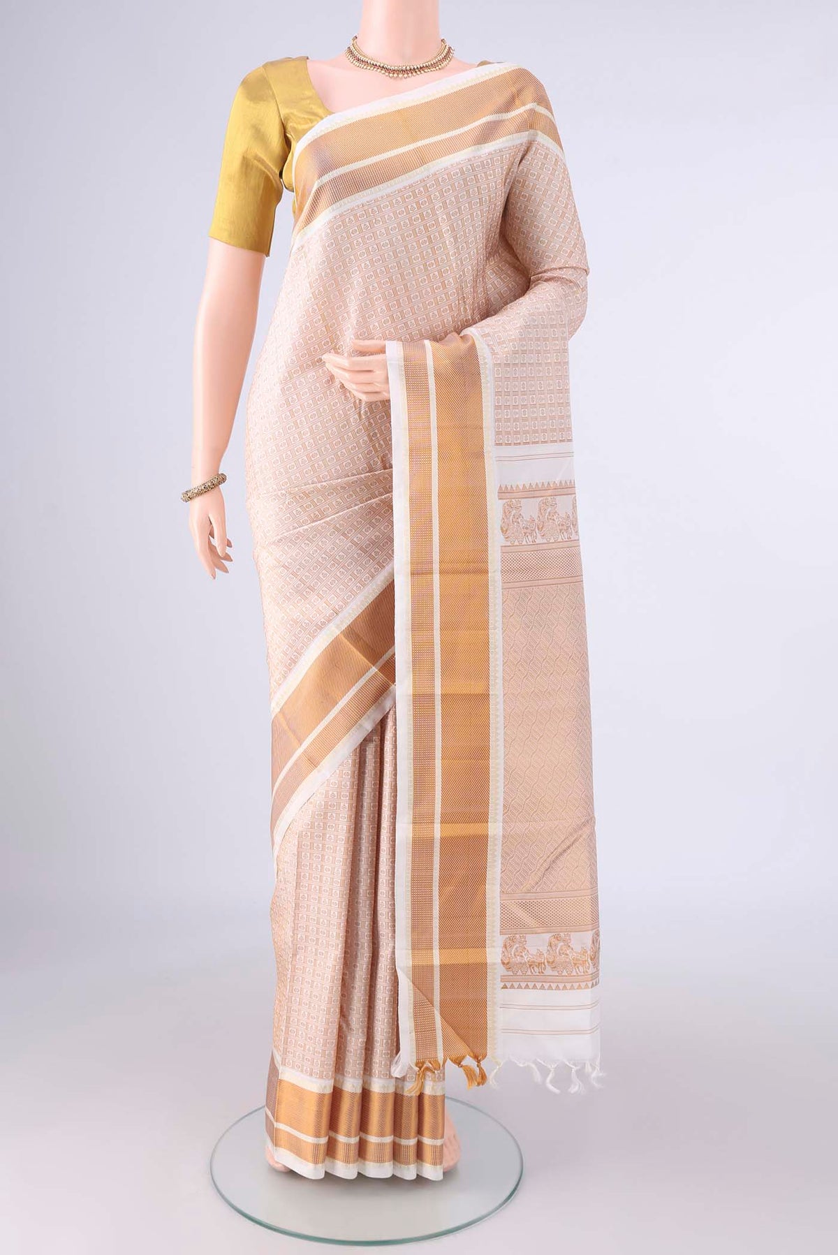 Pure Silk Off White Kanjivaram Saree with Thread Brocade on the body and Thread Border.  displayed on a mannequin