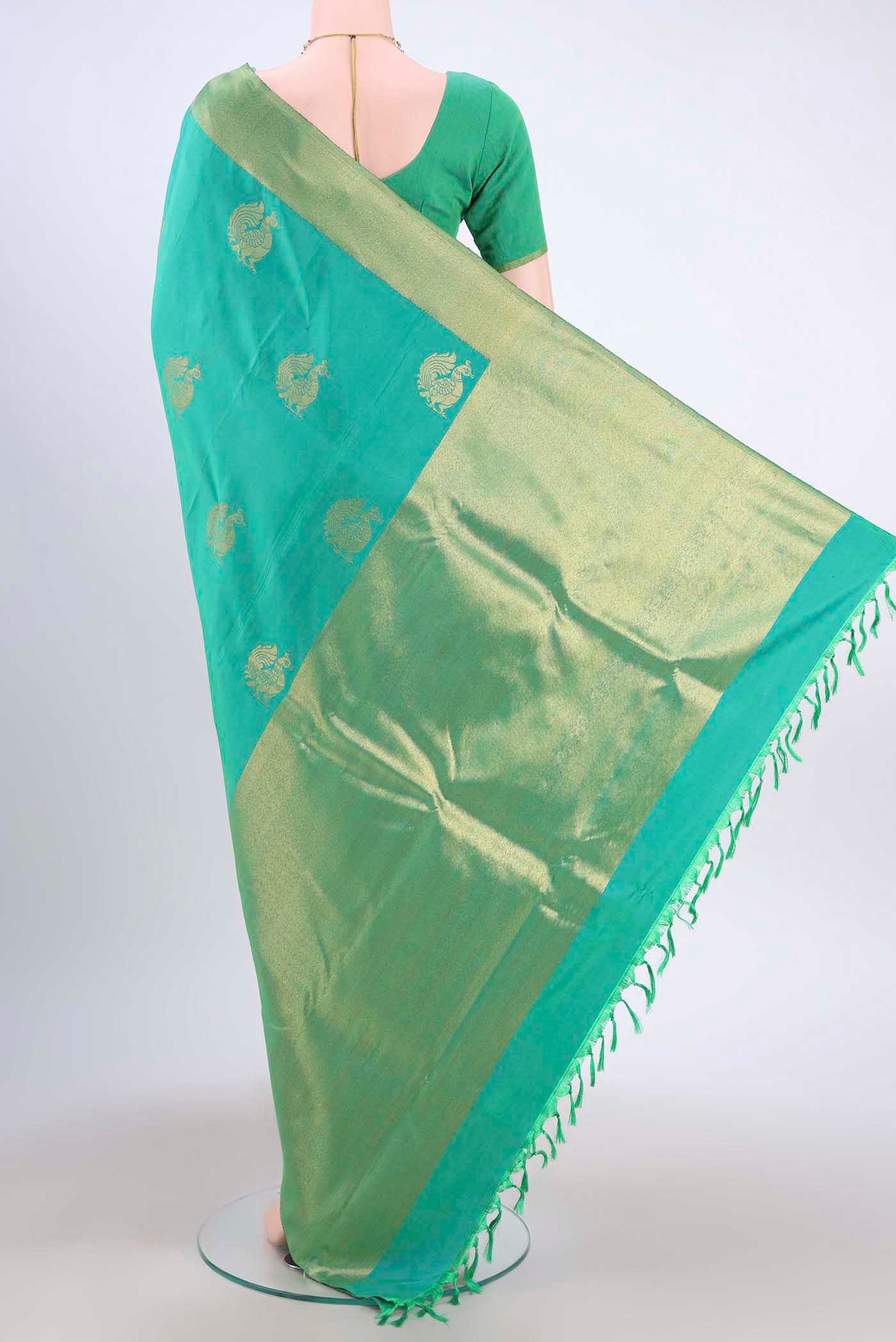 Flat view of Sea Green Kanchipuram Silk Saree with Zari Butta on the body and Zari Border