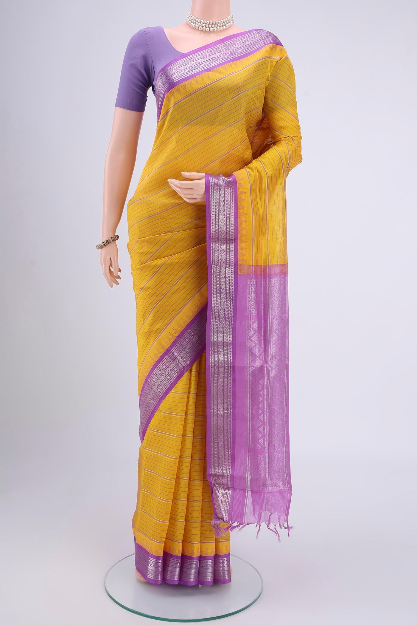 Lemon Yellow Blended Coimbatore Silk Cotton Saree with Stripes on the body and Zari Border.  displayed on a mannequin