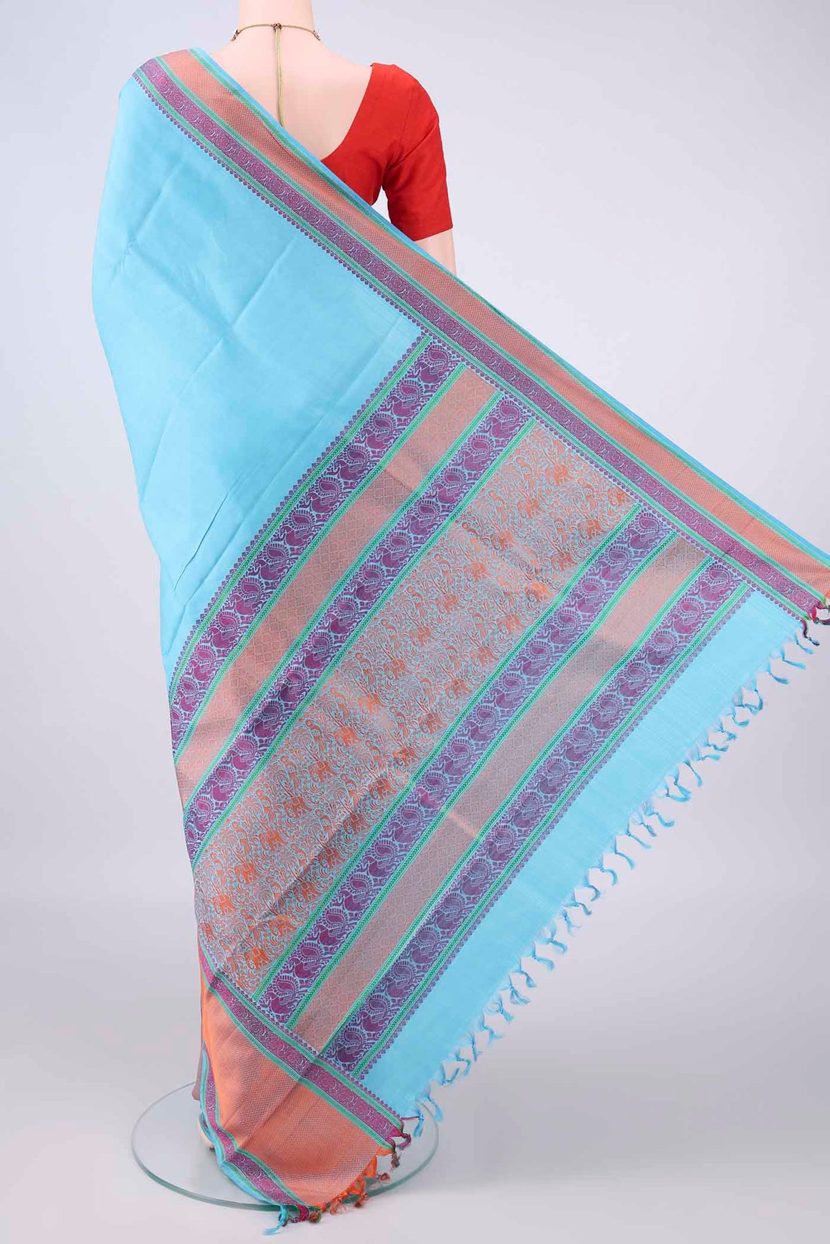 Flat view of Pure Silk Sky Blue Kanjivaram Saree with Plain Body and Thread Border. 