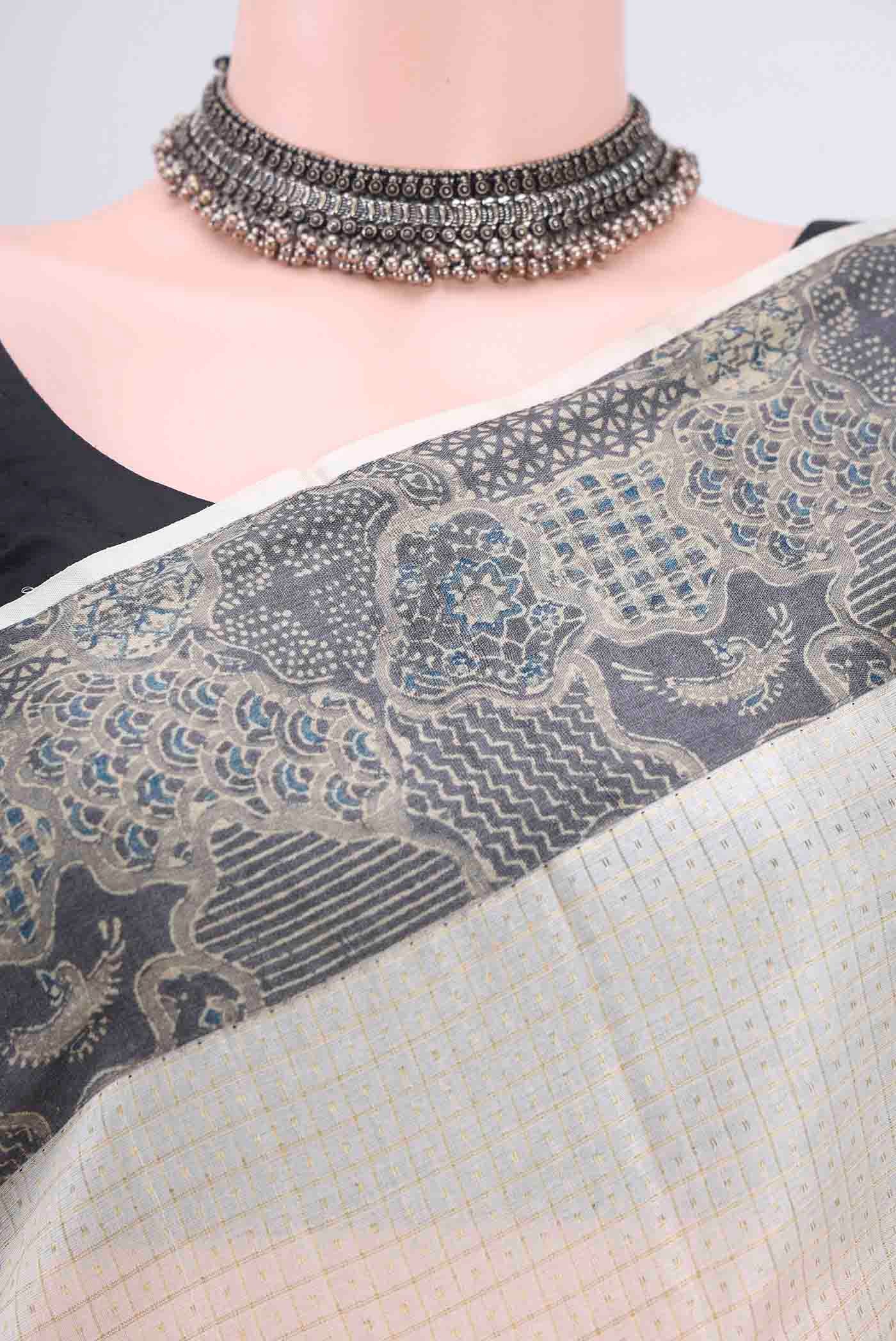 Border image of Off White Tussar Silk Saree with Zari Butta on the body and Printed Border