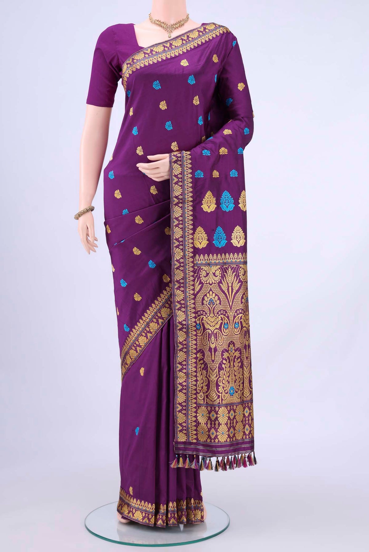 Burgundy Dual Tone Assam Silk Saree with Zari Butta on the body and Zari Border displayed on a mannequin