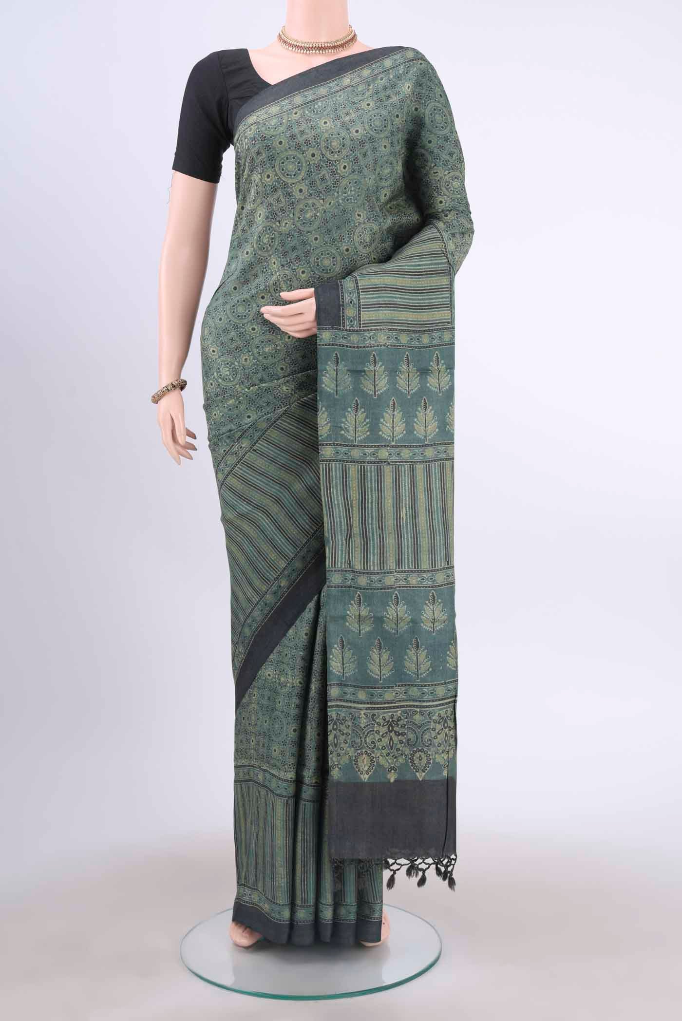Light Green Tussar Silk Saree with Ajrakh Print on the body and Printed Border displayed on a mannequin