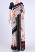 Off White Chanderi Silk Saree with Printed design on the body and Zari Border displayed on a mannequin