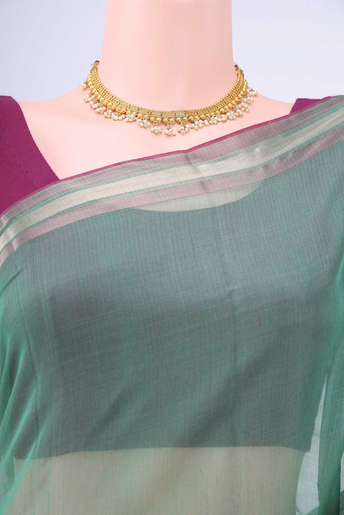 Border image of Sage Green Kora Cotton Saree with Zari Butta on the body and Zari Border