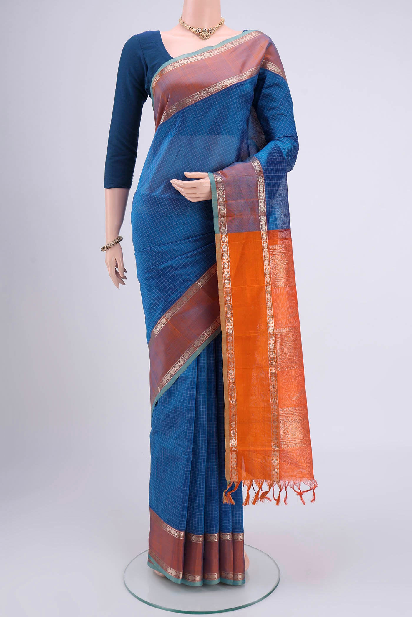 Blue Dual Tone Blended Coimbatore Silk Cotton Saree with Checked design on the body and Zari Border.  displayed on a mannequin