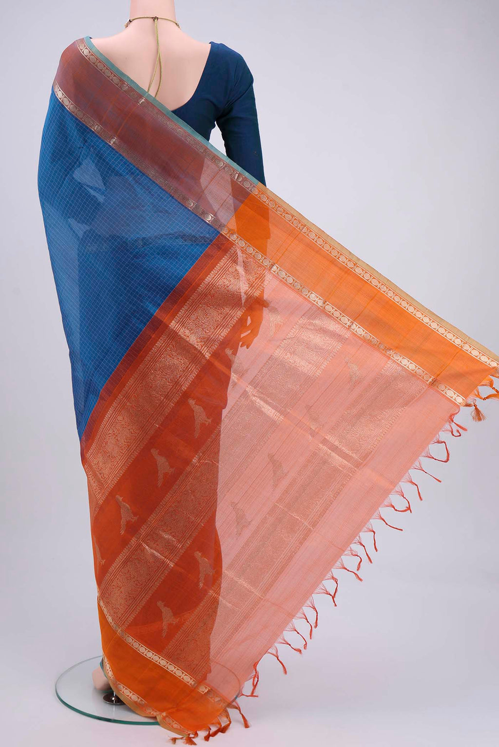 Flat view of Blue Dual Tone Blended Coimbatore Silk Cotton Saree with Checked design on the body and Zari Border. 