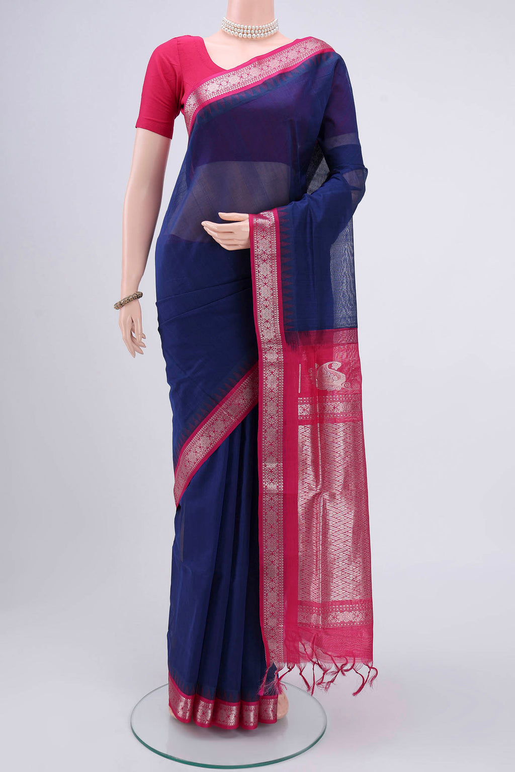Dark Blue Blended Coimbatore Silk Cotton Saree with Plain Body and Zari Border.  displayed on a mannequin