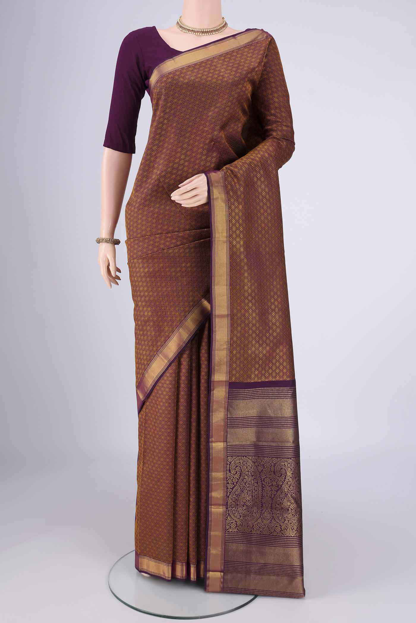 Pure Silk Pure Zari Burgundy Kanjivaram Saree with Jacquard design on the body and Zari Border.  displayed on a mannequin