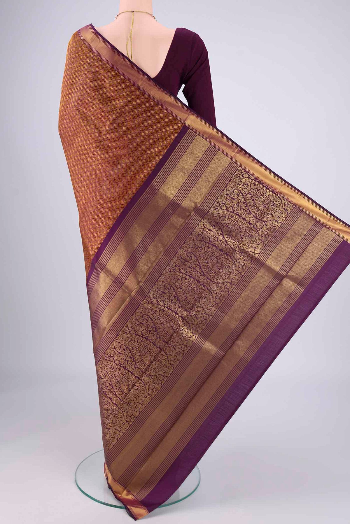 Flat view of Pure Silk Pure Zari Burgundy Kanjivaram Saree with Jacquard design on the body and Zari Border. 