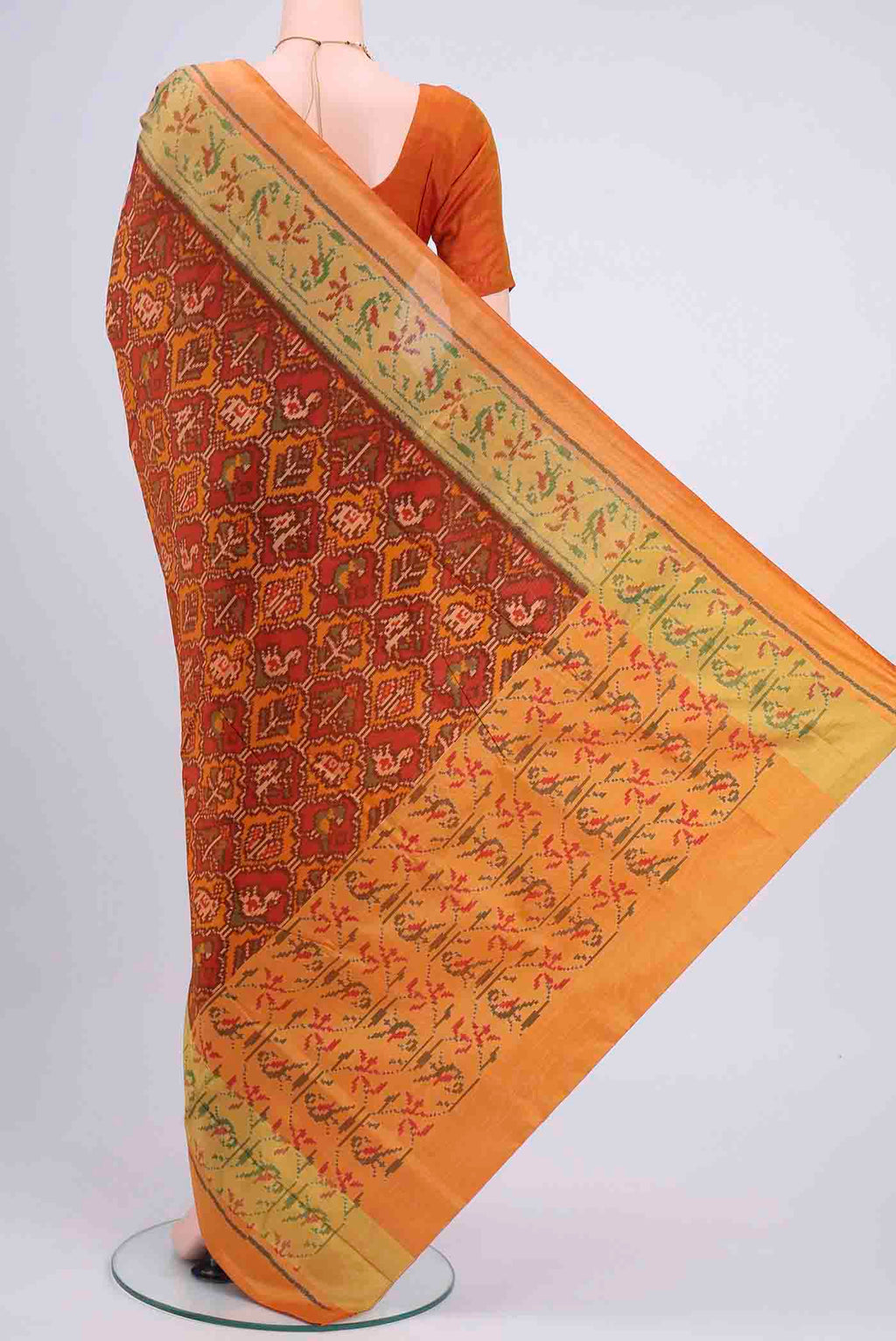 Flat view of Rust Rajkot Patola Silk Saree with Pure Ikat on the body and Zari Border