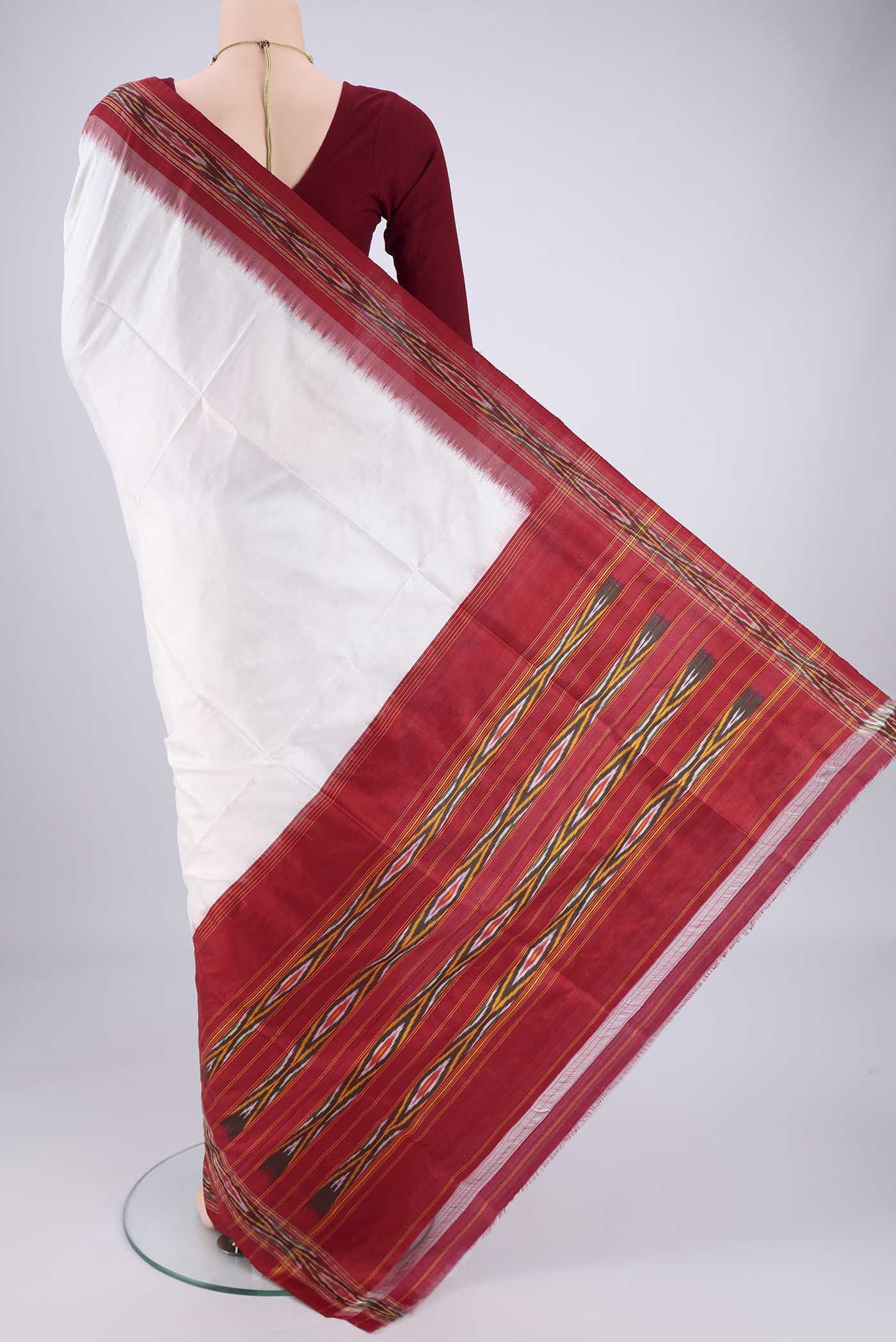 Flat view of Off White Pochampally Silk Saree with Plain Body and Ikat Border. 