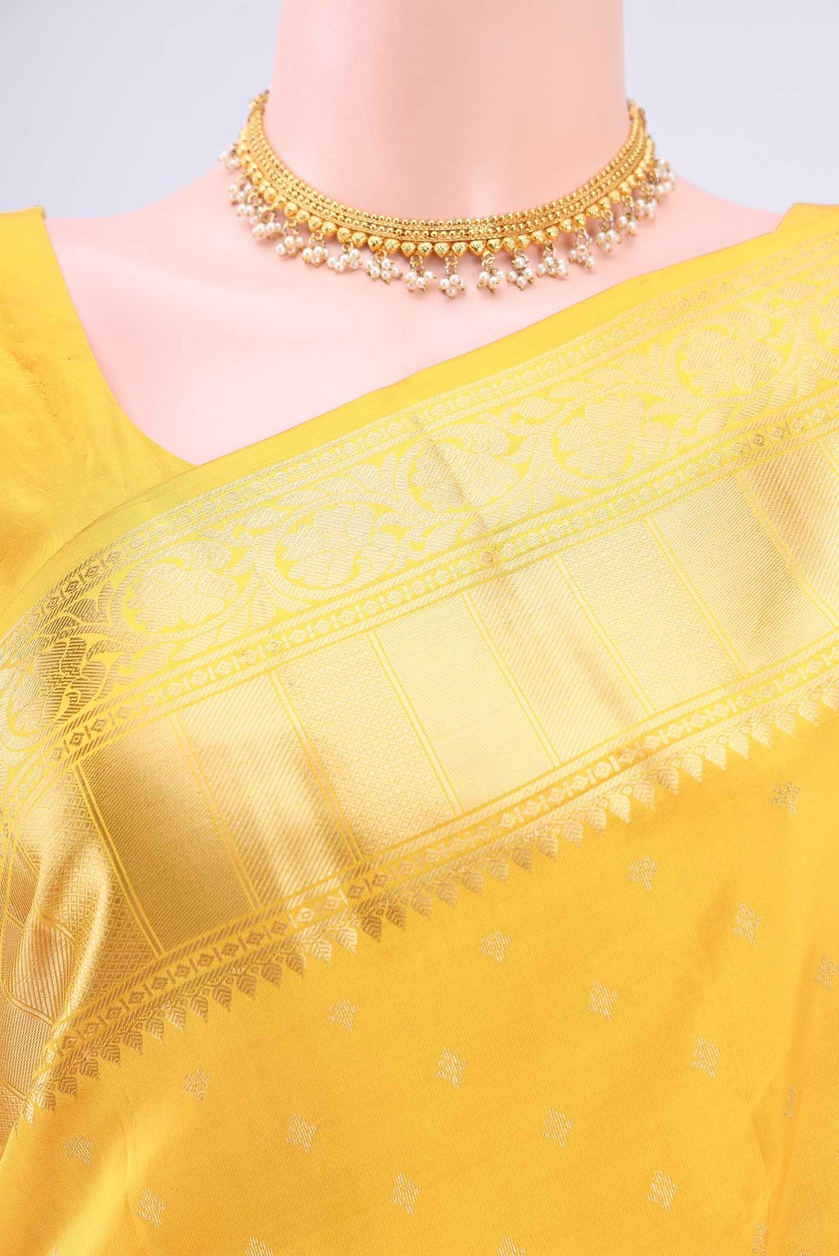 Border image of Lemon Yellow Nangavalli Silk [ Salem ] Saree with Zari Butta on the body and Zari Border