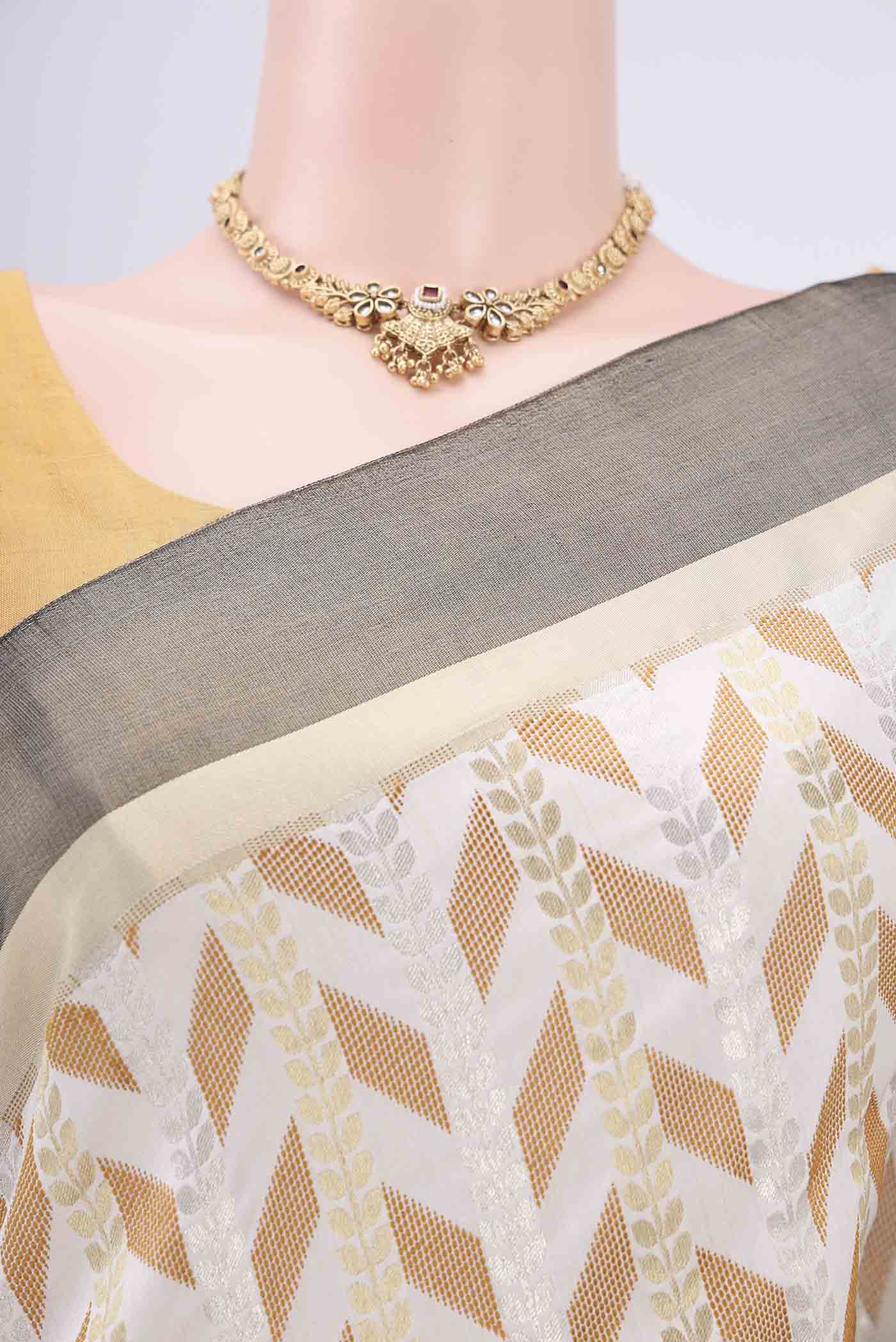 Border image of White Soft Silk Saree with Zari Butta on the body and Without Border. 