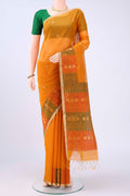 Mustard Kota Cotton Saree with Zari Butta on the body and Zari Border displayed on a mannequin