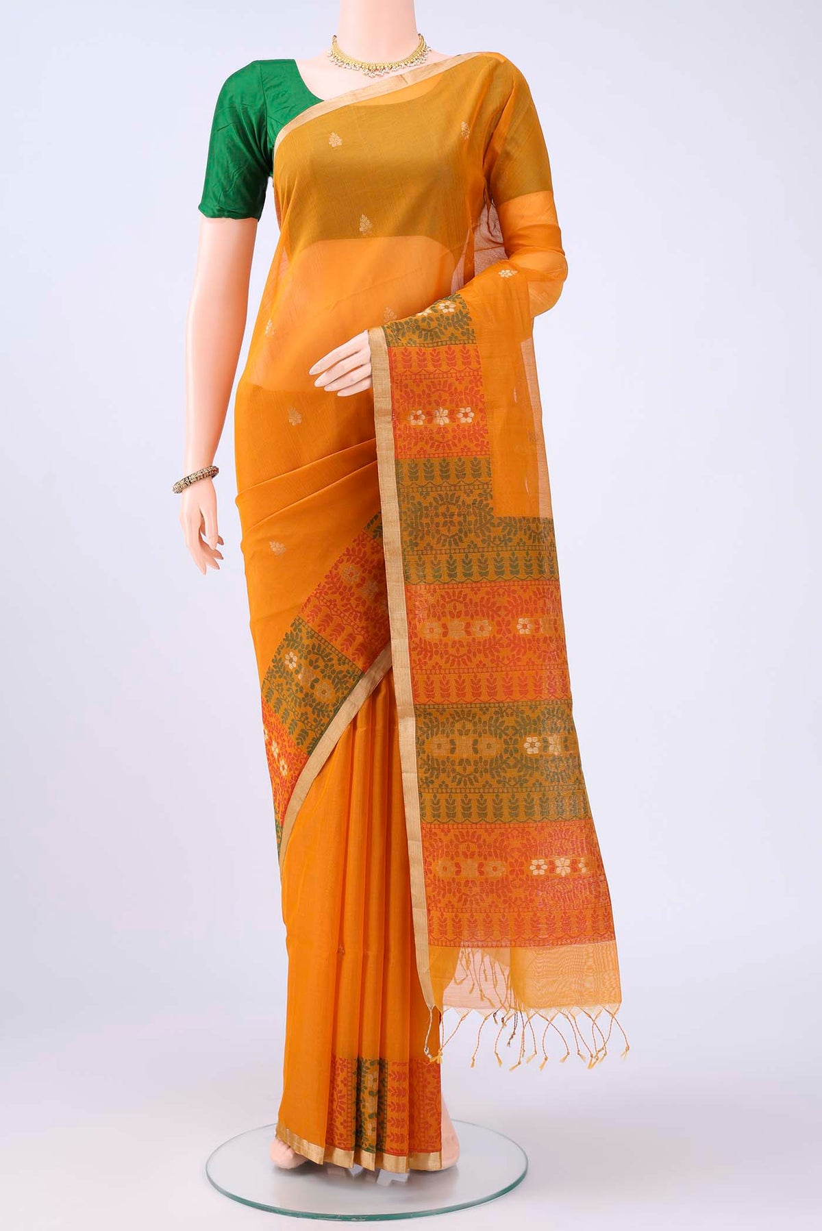 Mustard Kota Cotton Saree with Zari Butta on the body and Zari Border displayed on a mannequin