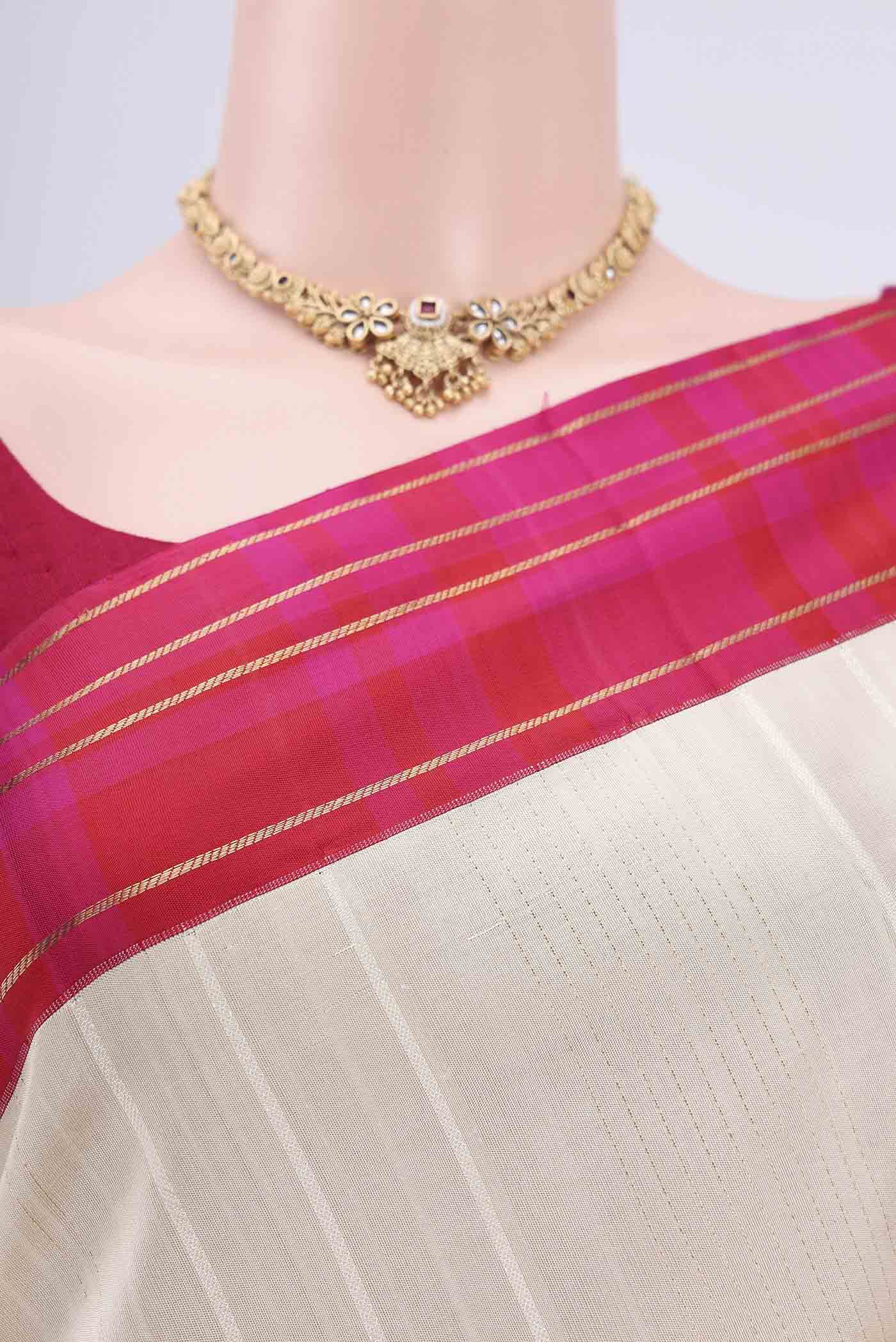 Border image of Cream Soft Silk Saree with Zari Butta on the body and Zari Border. 