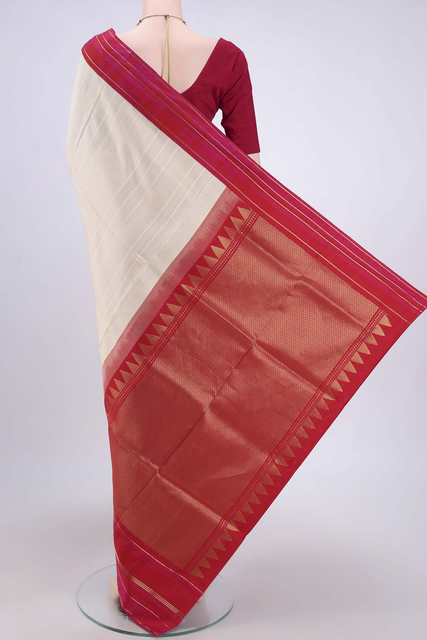 Flat view of Cream Soft Silk Saree with Zari Butta on the body and Zari Border. 