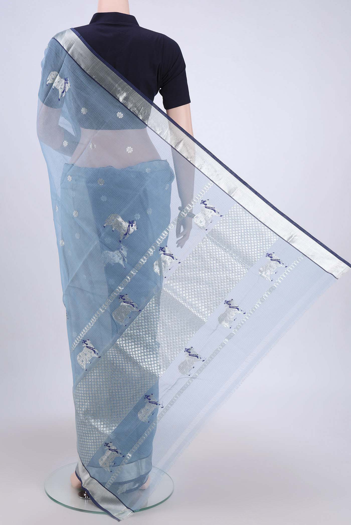 Flat view of Pure Silk Pure Zari Light Blue Kota Cotton Saree with Zari And Thread Butta on the body and Zari Border. 