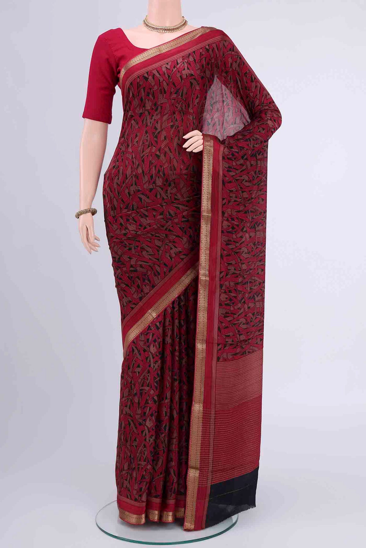 Black Mysore Crepe Saree with Floral Print on the body and Printed Border displayed on a mannequin