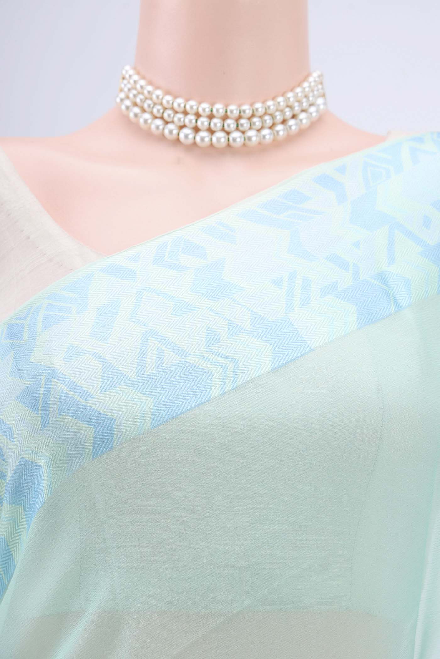 Border image of Turquoise Mysore Chiffon Saree with Plain Body and Printed Border. 