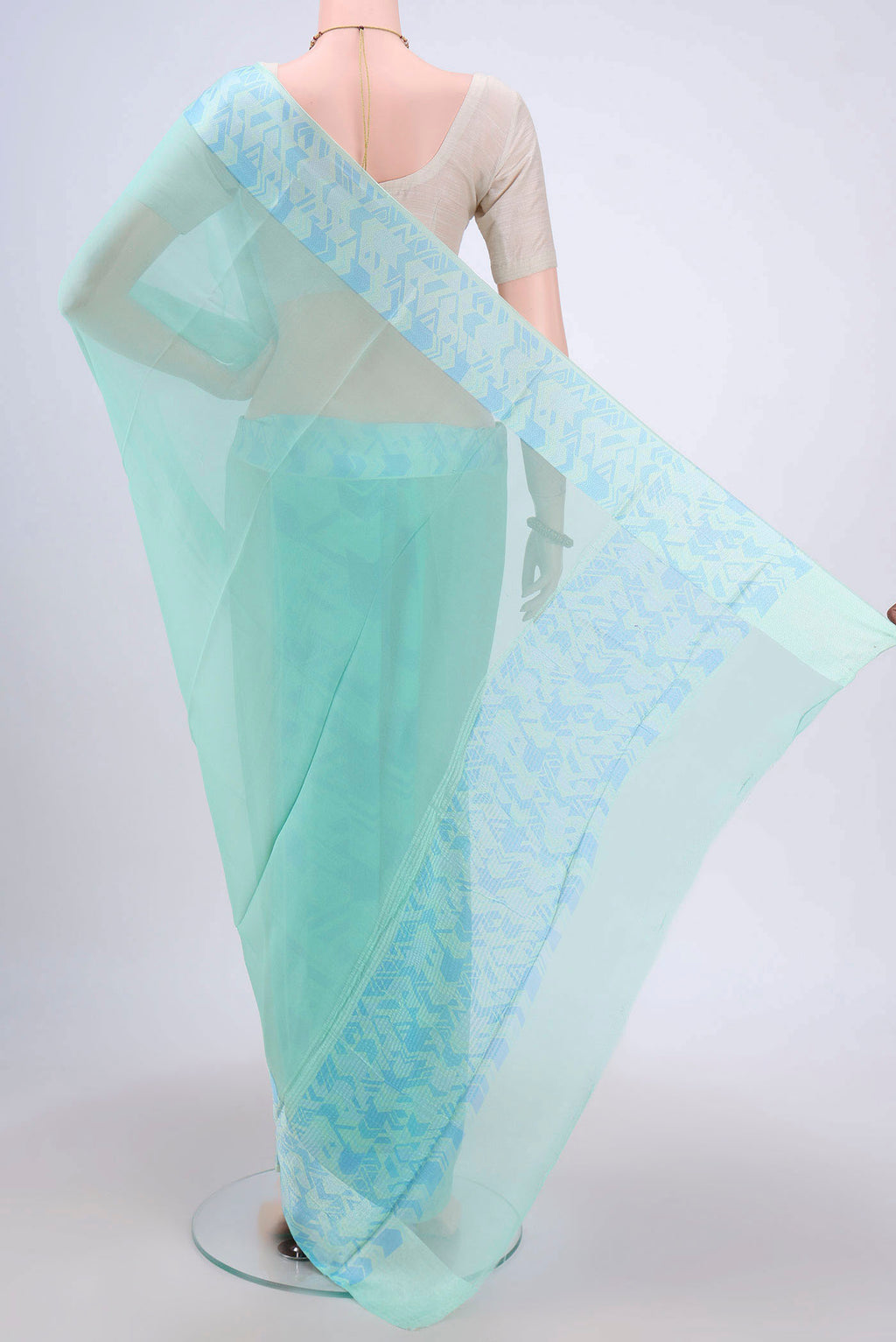 Flat view of Turquoise Mysore Chiffon Saree with Plain Body and Printed Border. 