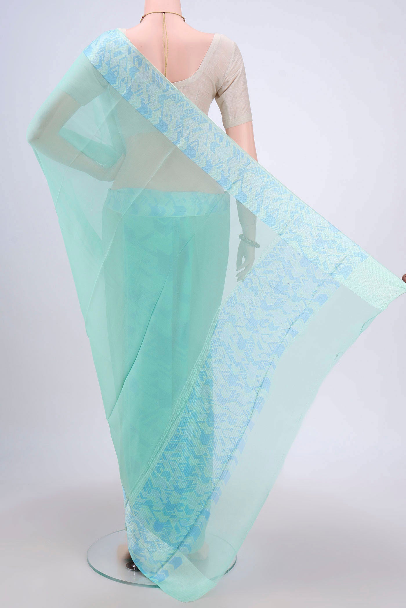 Flat view of Turquoise Mysore Chiffon Saree with Plain Body and Printed Border. 