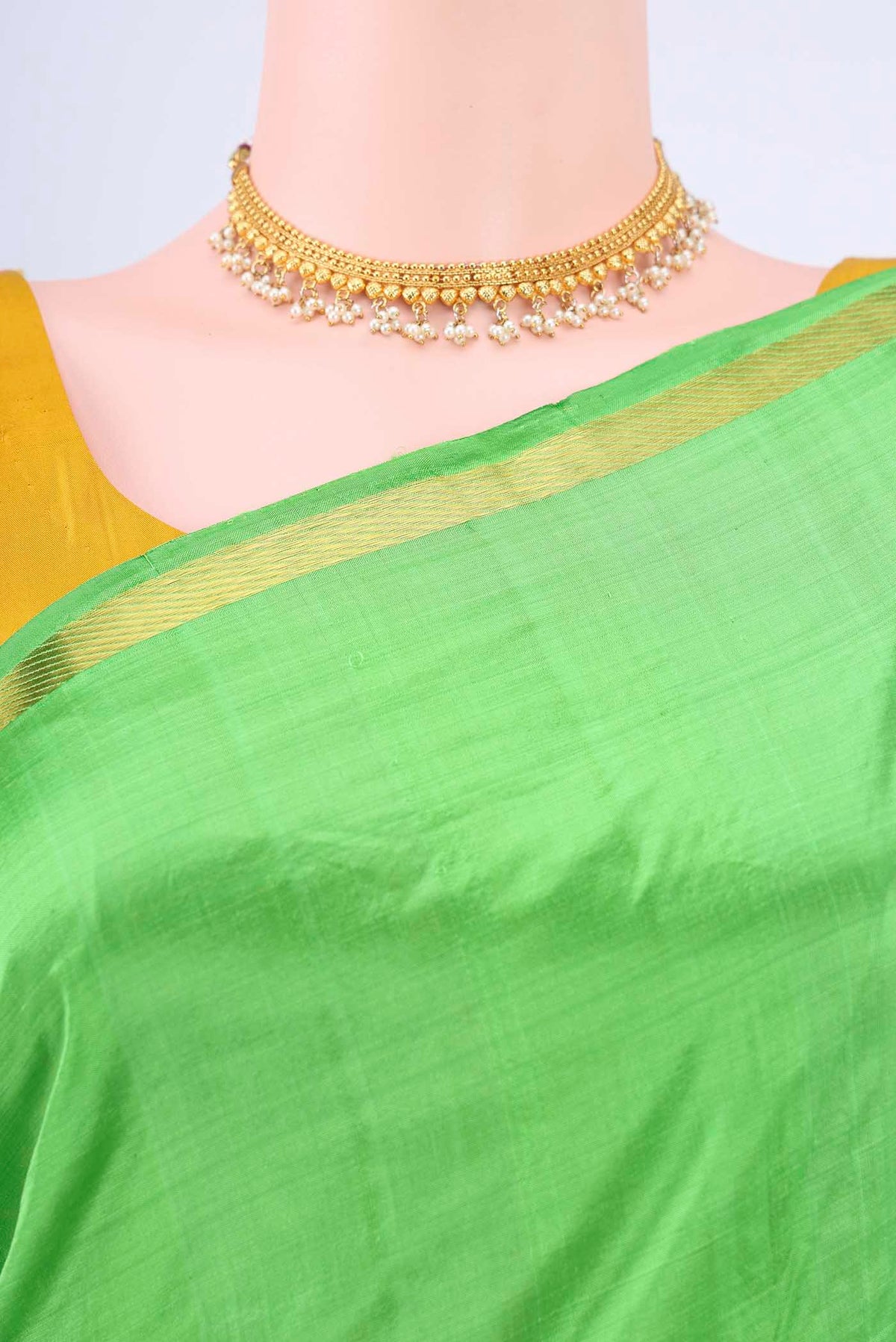 Border image of Parrot Green Kanchipuram Silk Saree with Plain Body and Zari And Thread Border