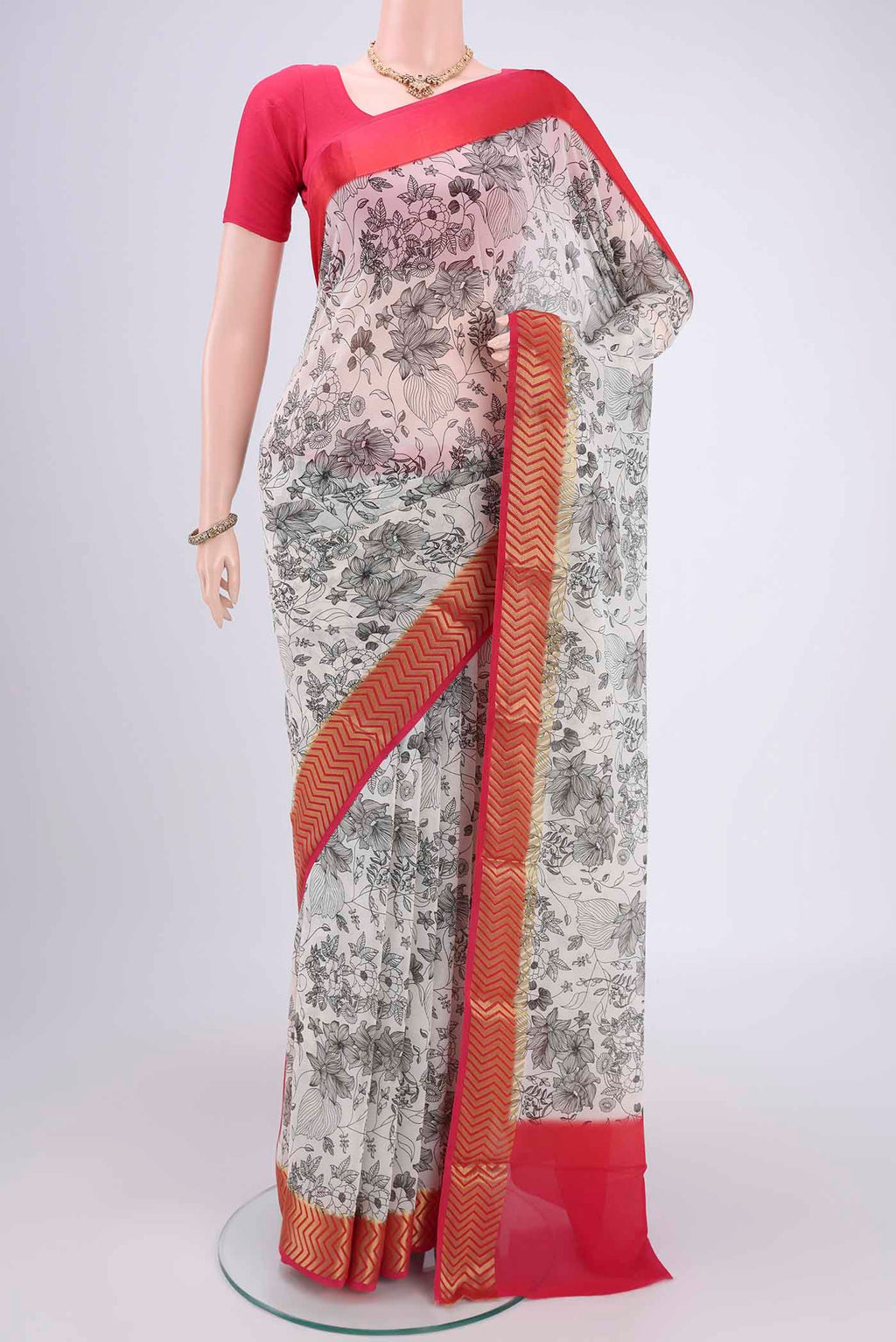 White Mysore Crepe Saree with Floral Print on the body and Without Border.  displayed on a mannequin