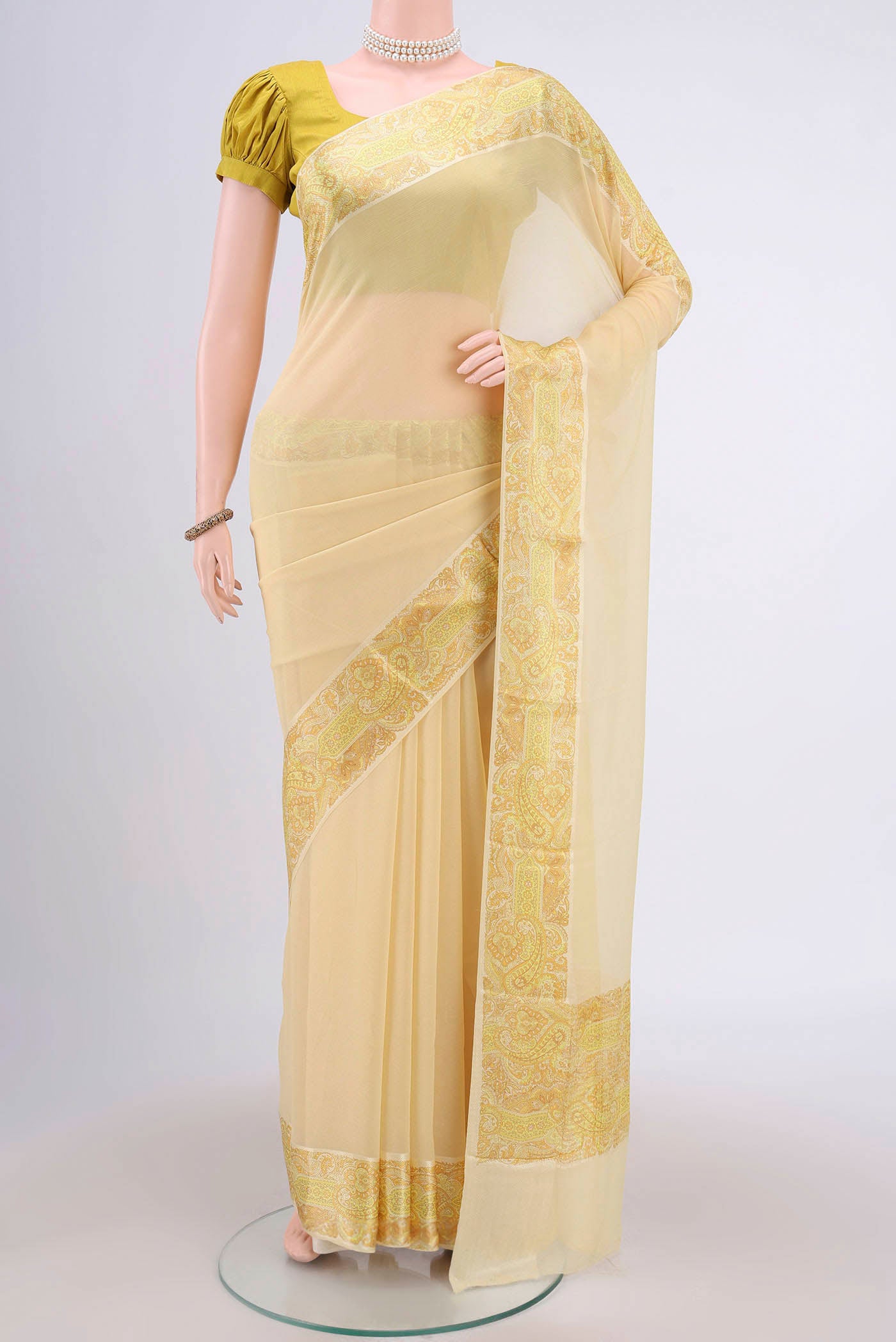 Yellow Mysore Chiffon Saree with Plain Body and Printed Border.  displayed on a mannequin
