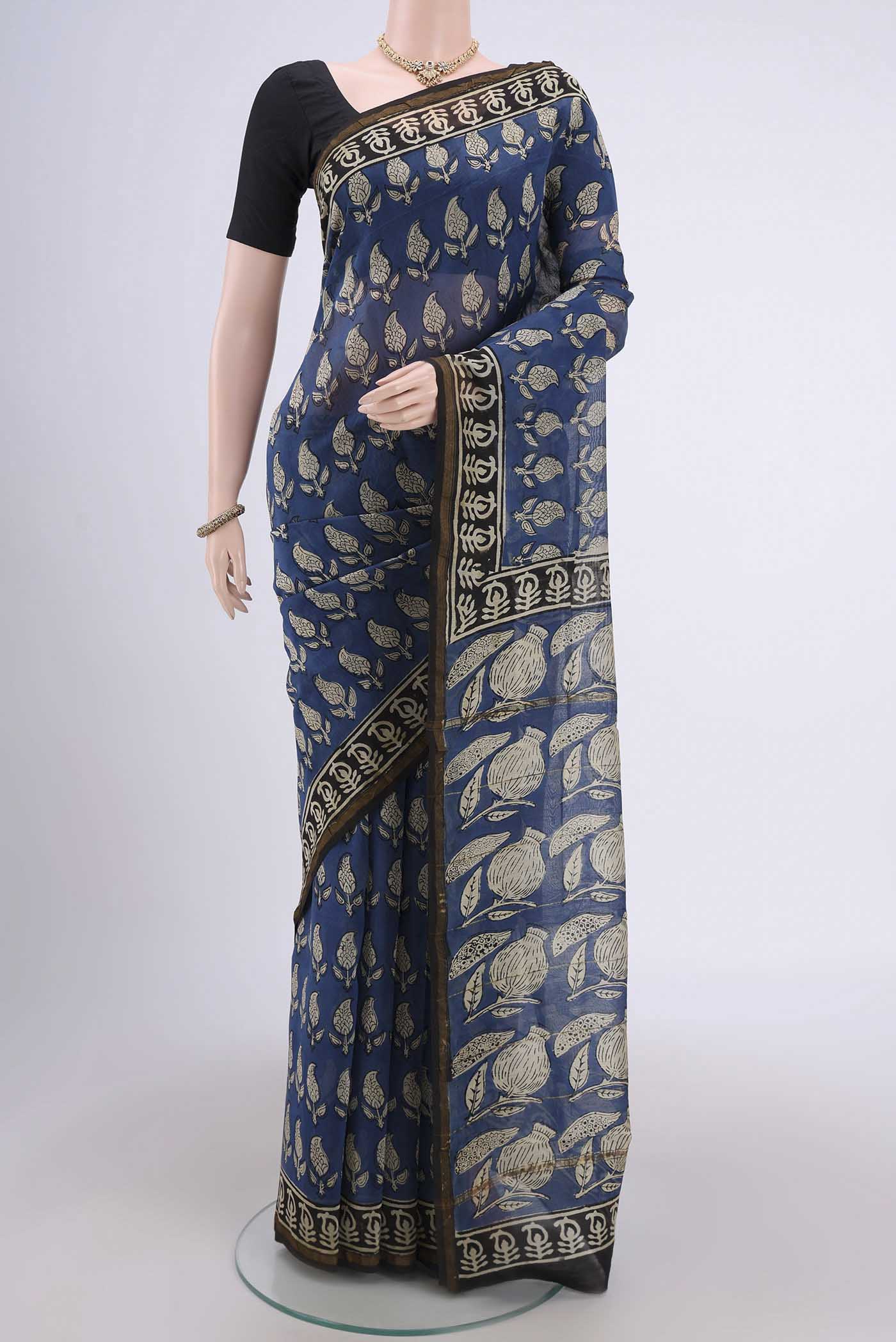 Blue Chanderi Silk Cotton Saree with Printed design on the body and Zari Border.  displayed on a mannequin