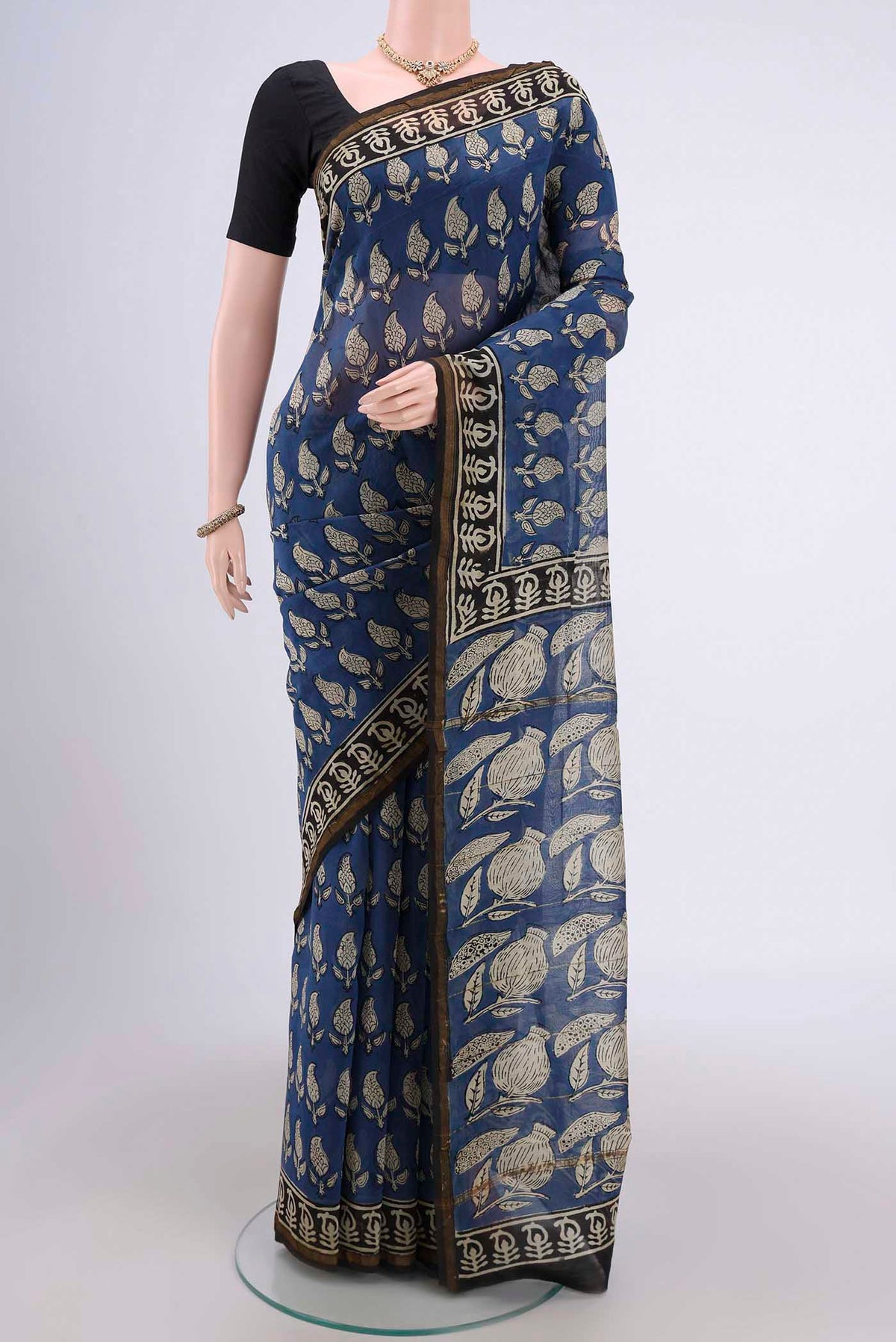 Blue Chanderi Silk Cotton Saree with Printed design on the body and Zari Border.  displayed on a mannequin