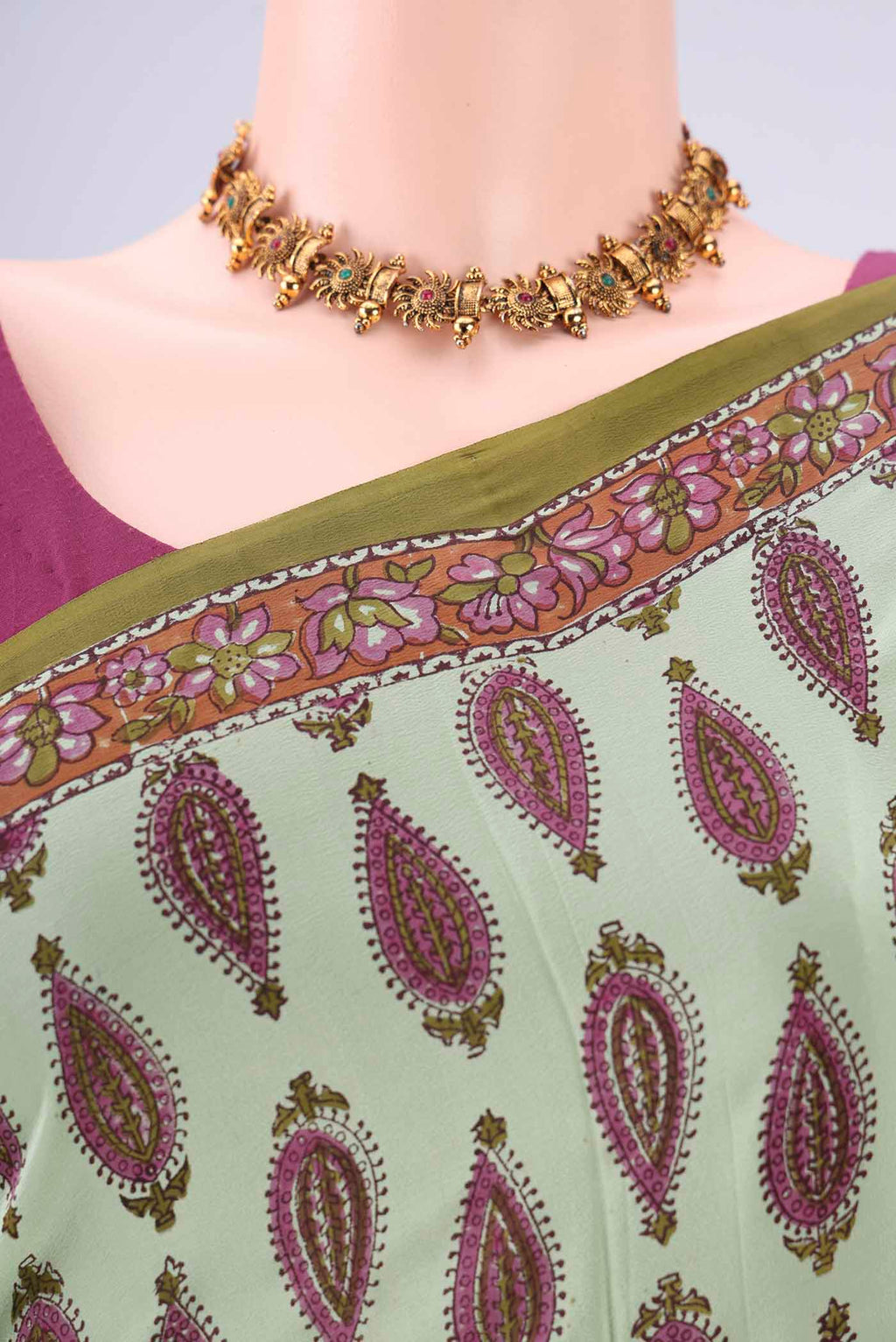 Border image of Mint Green Mysore Crepe Saree with Floral Print on the body and Zari Border. 